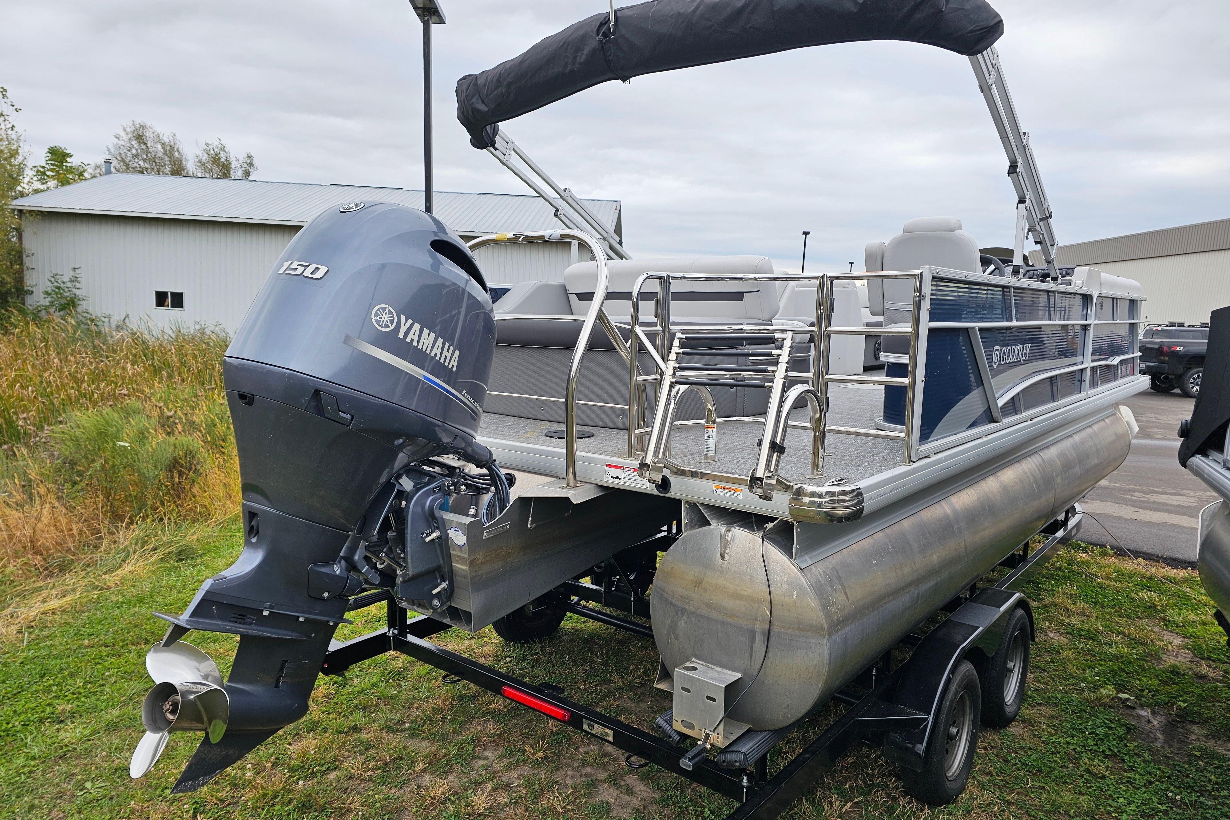 2022 Sweetwater 2286 SFL pontoon boat with Yamaha 150 engine on trailer.