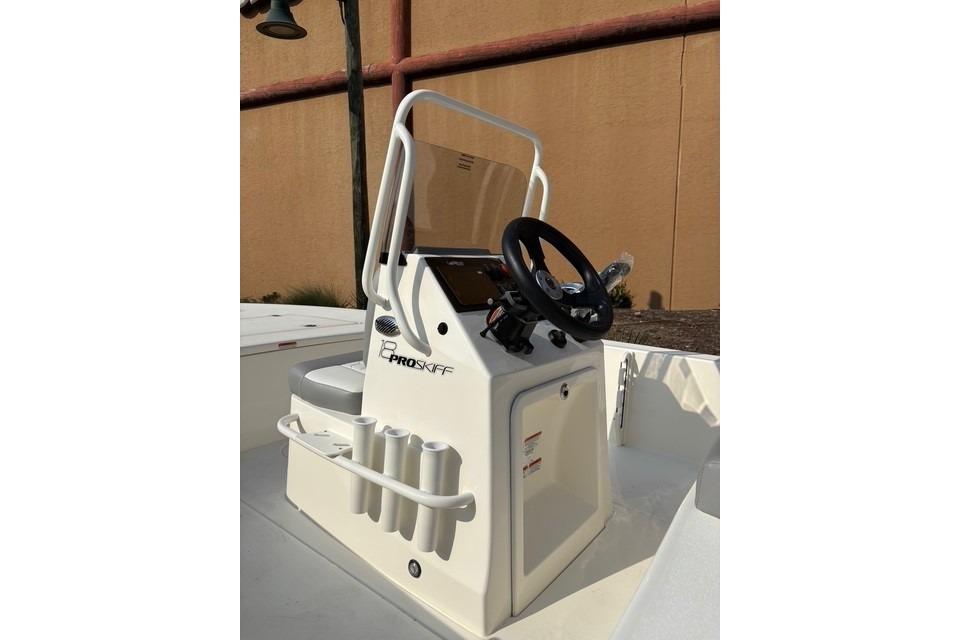 2026 Mako 18 Pro Skiff boat console with steering wheel and rod holders.