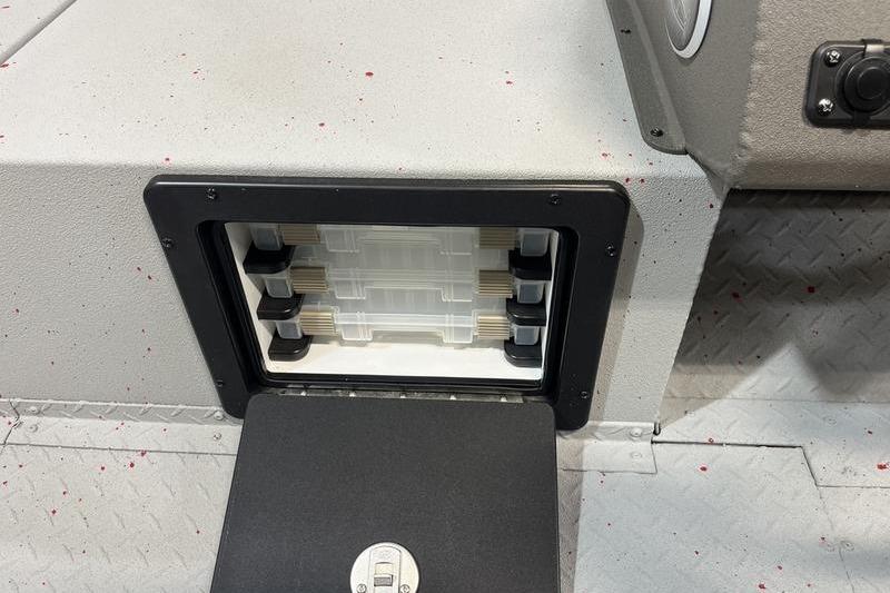 2026 SeaArk Flex 19 Pro storage compartment with organized tackle boxes.