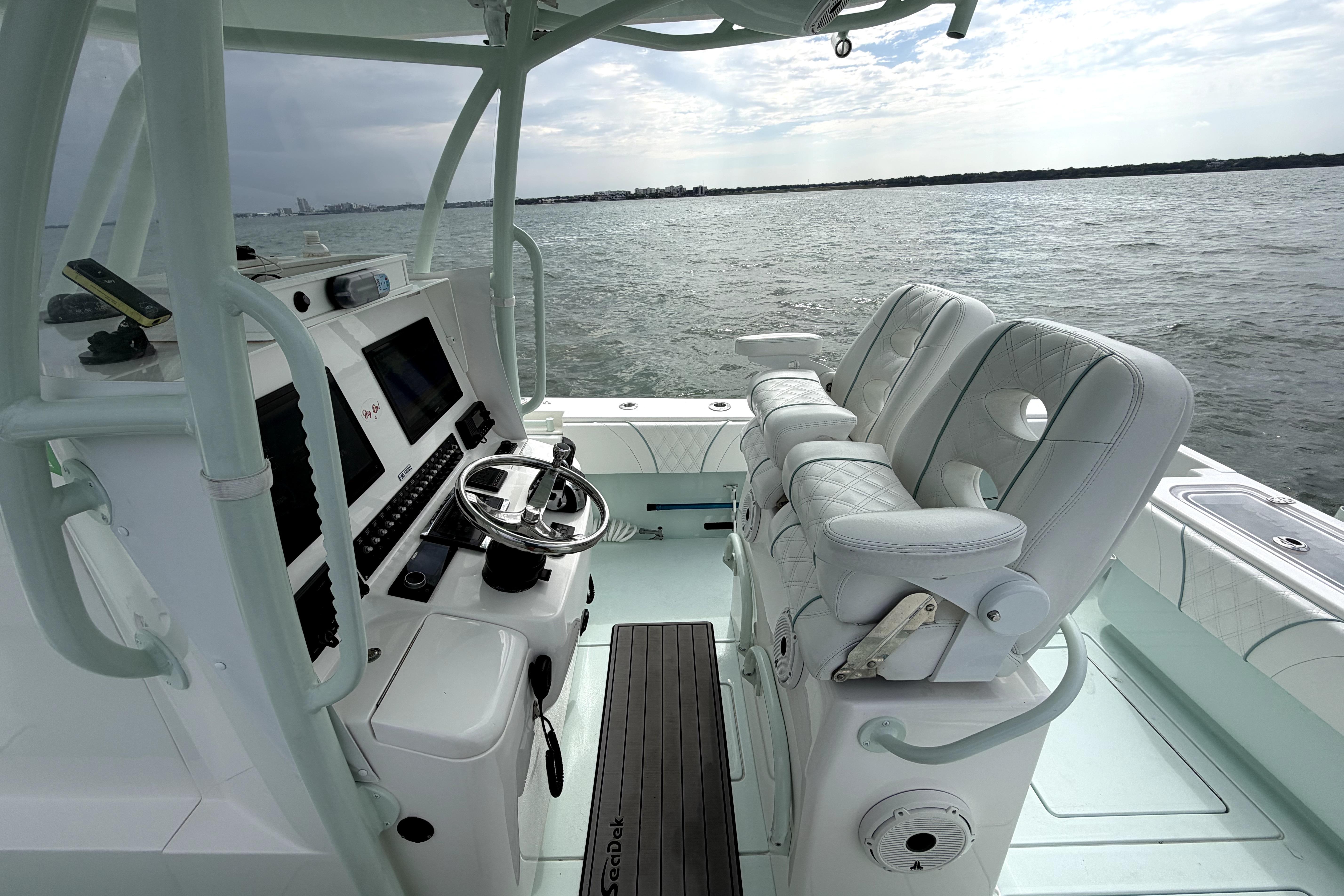 2019 Contender 30 ST boat interior with modern helm and plush seating on open water.