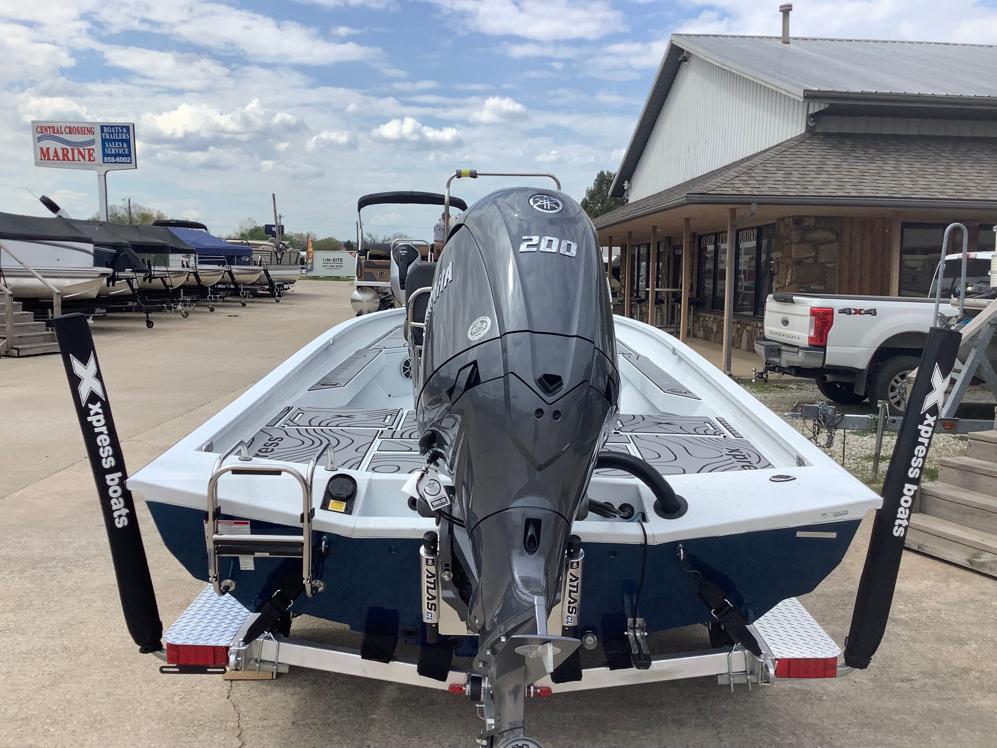 Xpress H22B Bay 2026 boat with Yamaha engine on trailer.