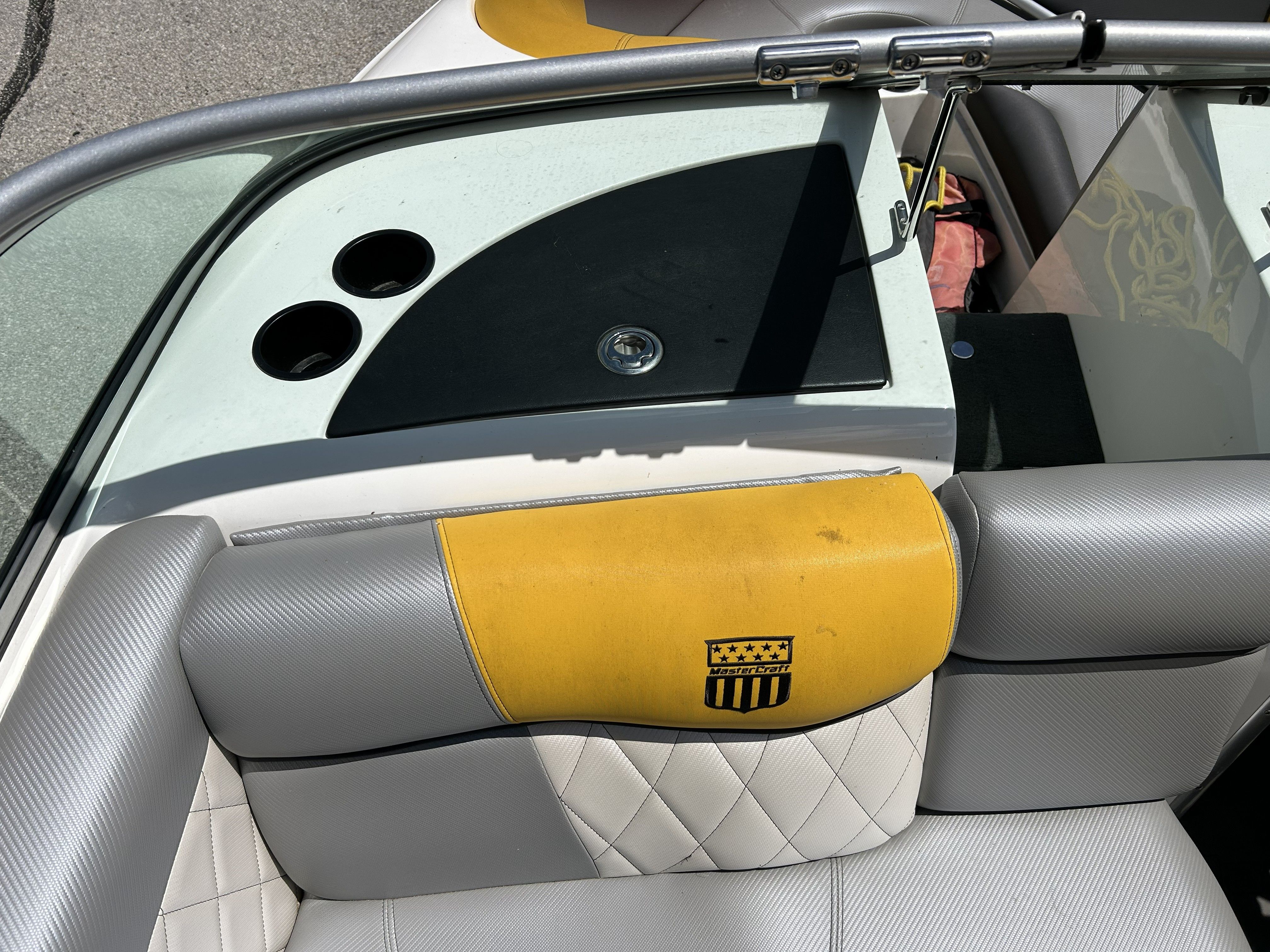 Interior of a 2011 MasterCraft PS197 boat with yellow upholstery.