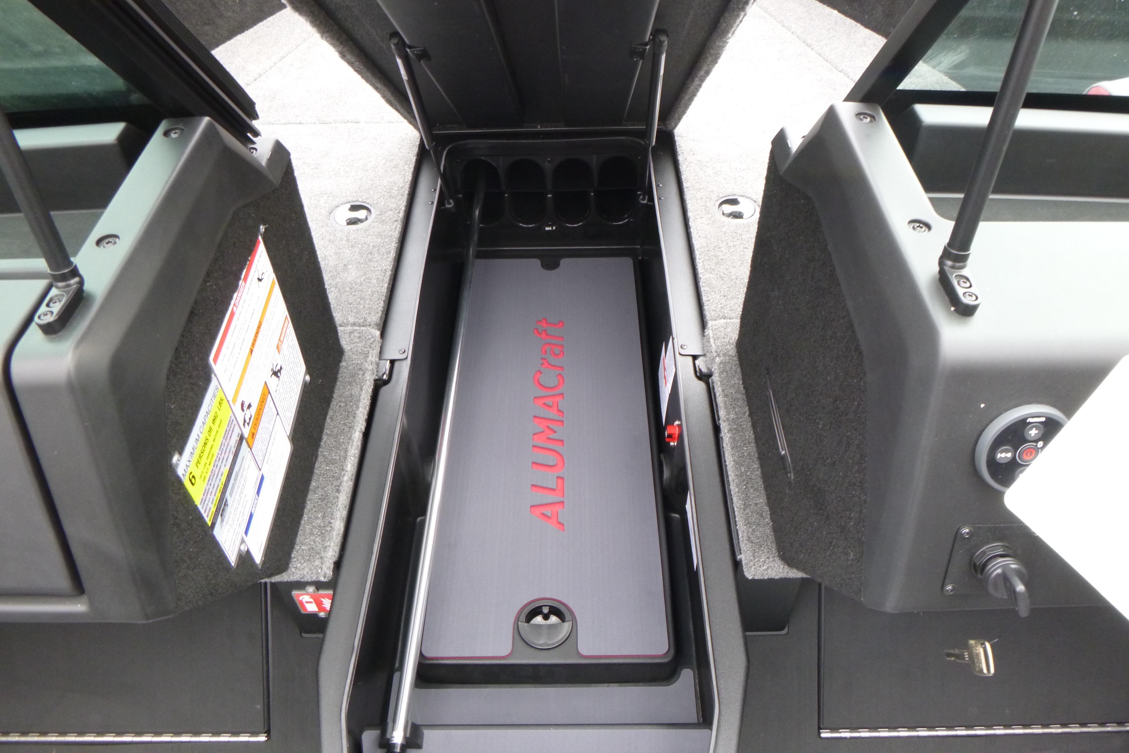 2025 Alumacraft Trophy 185X Sport boat storage compartment with open hatch.