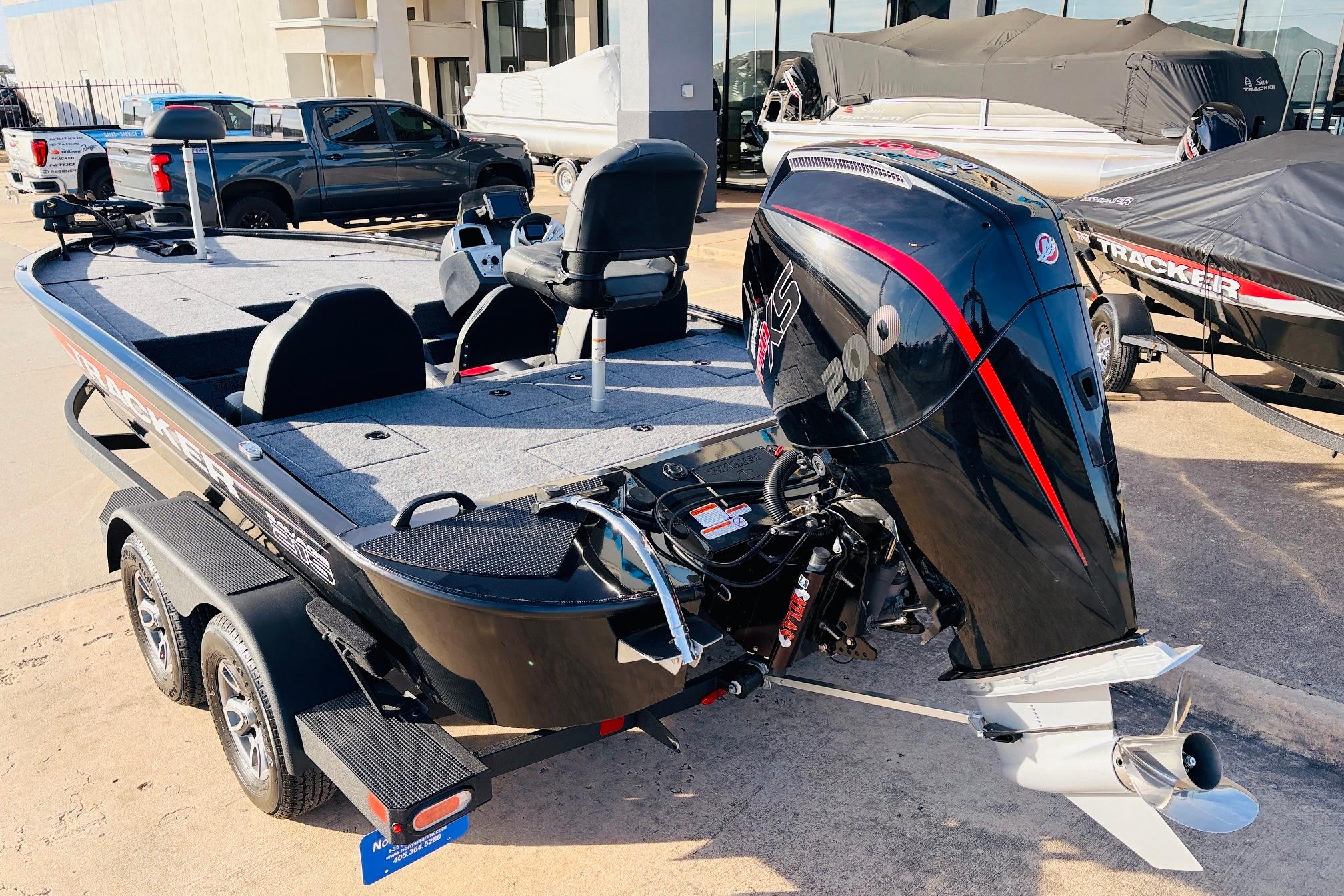 2025 Tracker Savage 215 boat with powerful engine, parked on a trailer.