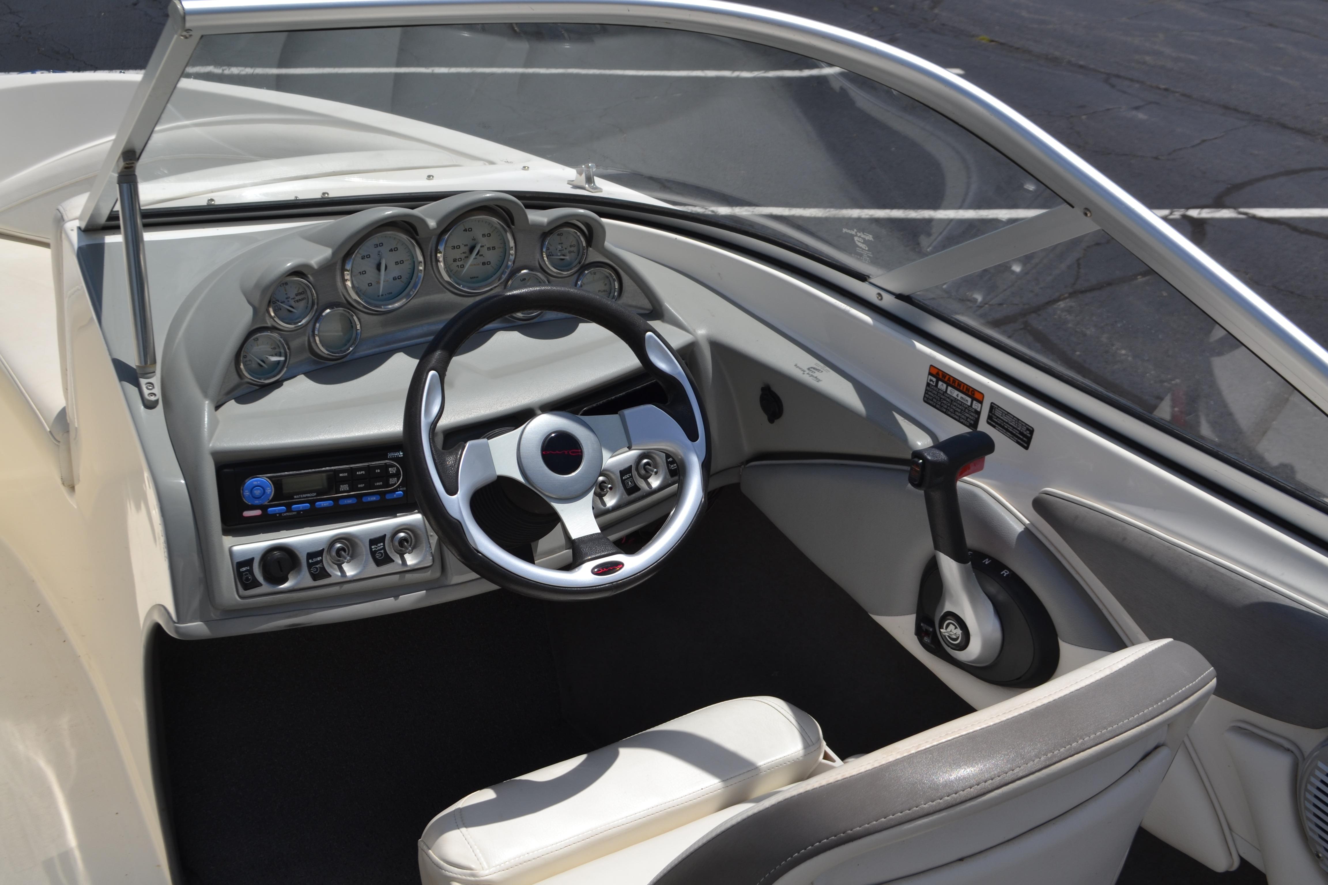2009 Bayliner 185 Bowrider dashboard with steering wheel and control panel.