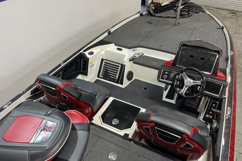 2022 Ranger Z520R boat interior with steering wheel and seating, featuring red and black accents.