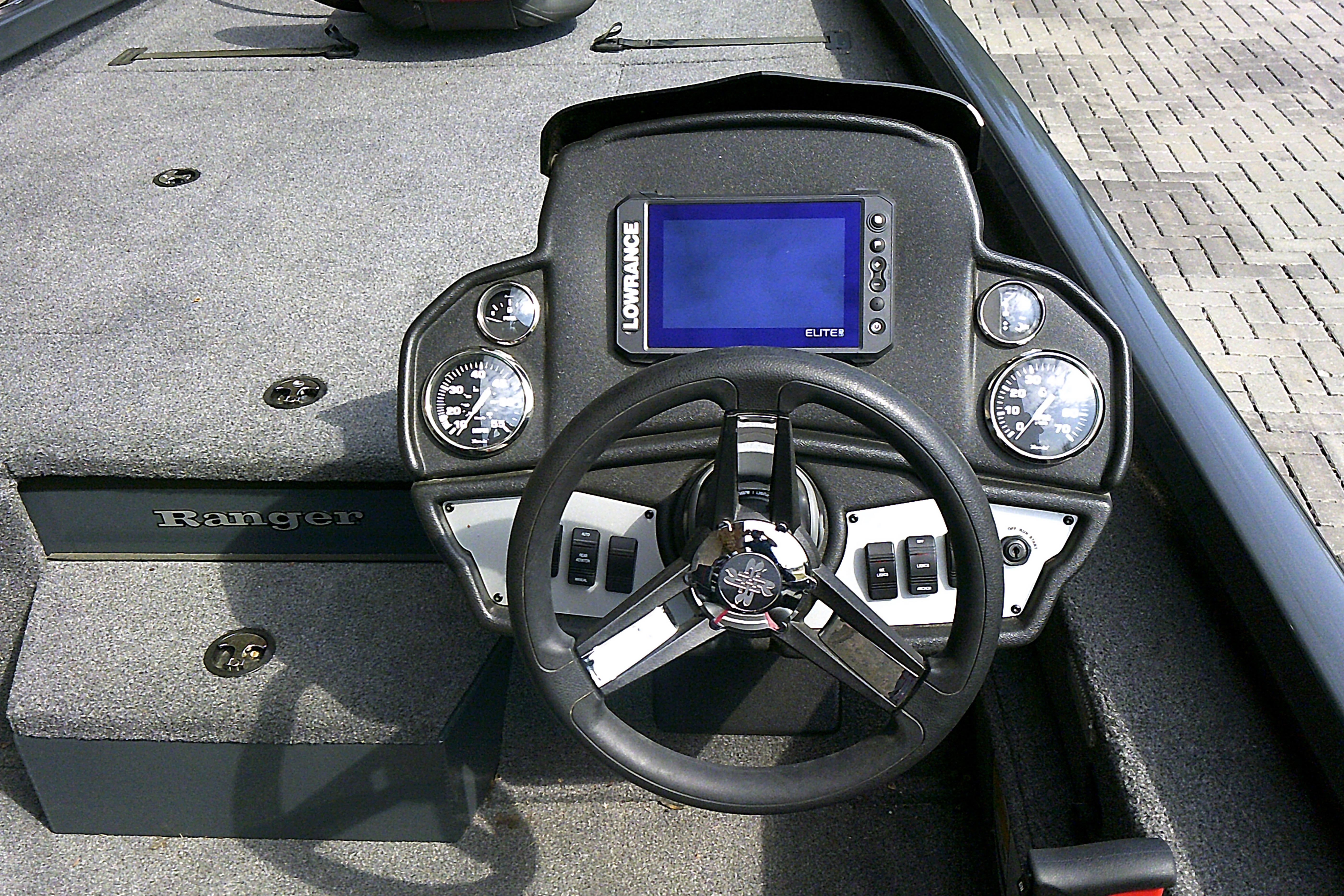 2025 Ranger RT198P boat dashboard with steering wheel and digital display.