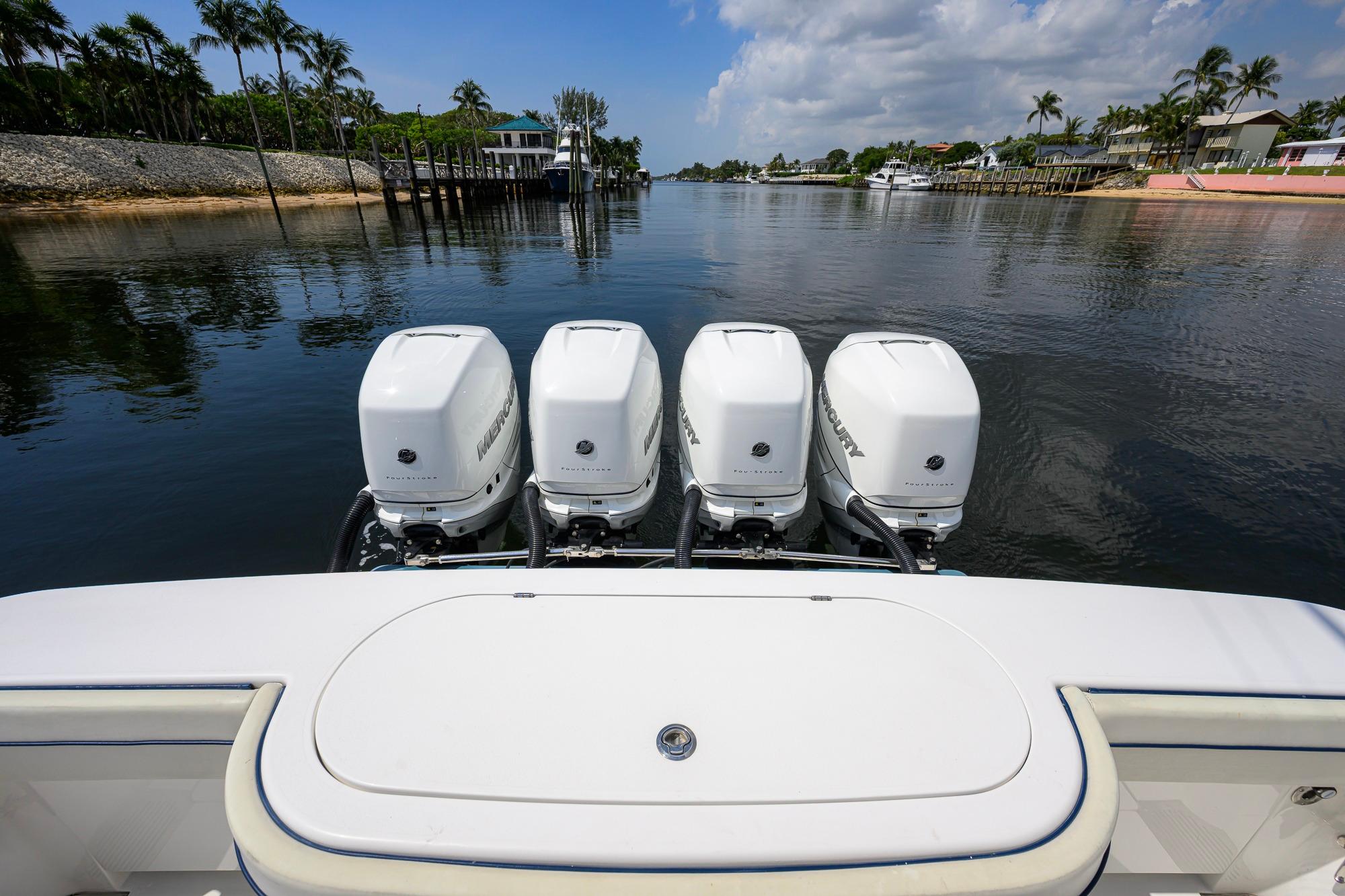2020 Valhalla Boatworks V-41 with four Mercury outboard engines on a calm waterway.