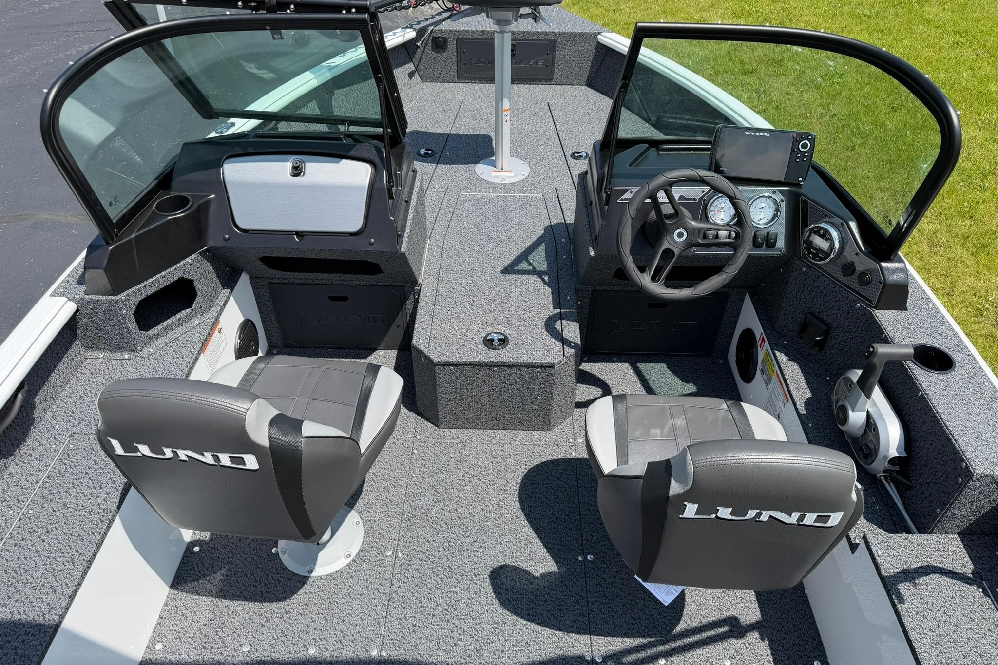 2027 Lund 1675 Adventure Sport boat interior with dual seats and modern dashboard.
