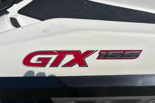 2010 Sea-Doo GTX 155 logo on white surface, close-up view.