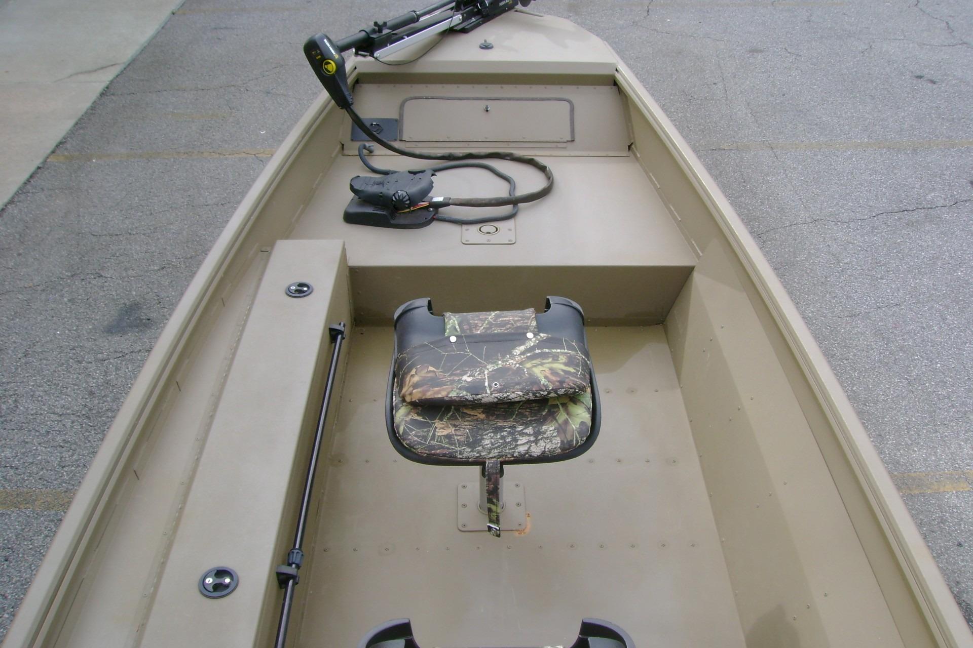 2023 G3 1652 DK boat interior with camo seat and trolling motor.