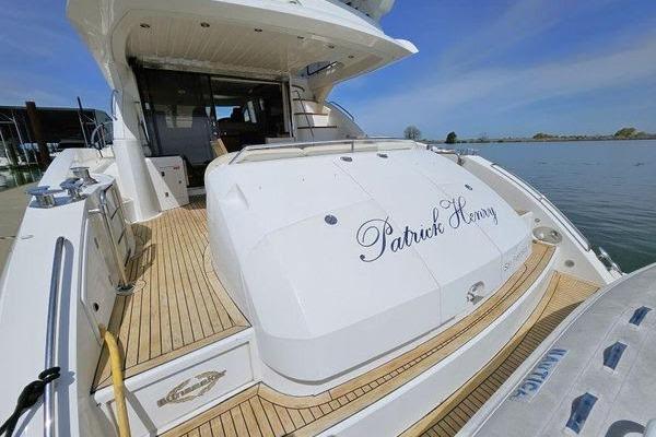 Luxury Sunseeker Manhattan 66 yacht, 2005 model, docked with elegant teak decking.