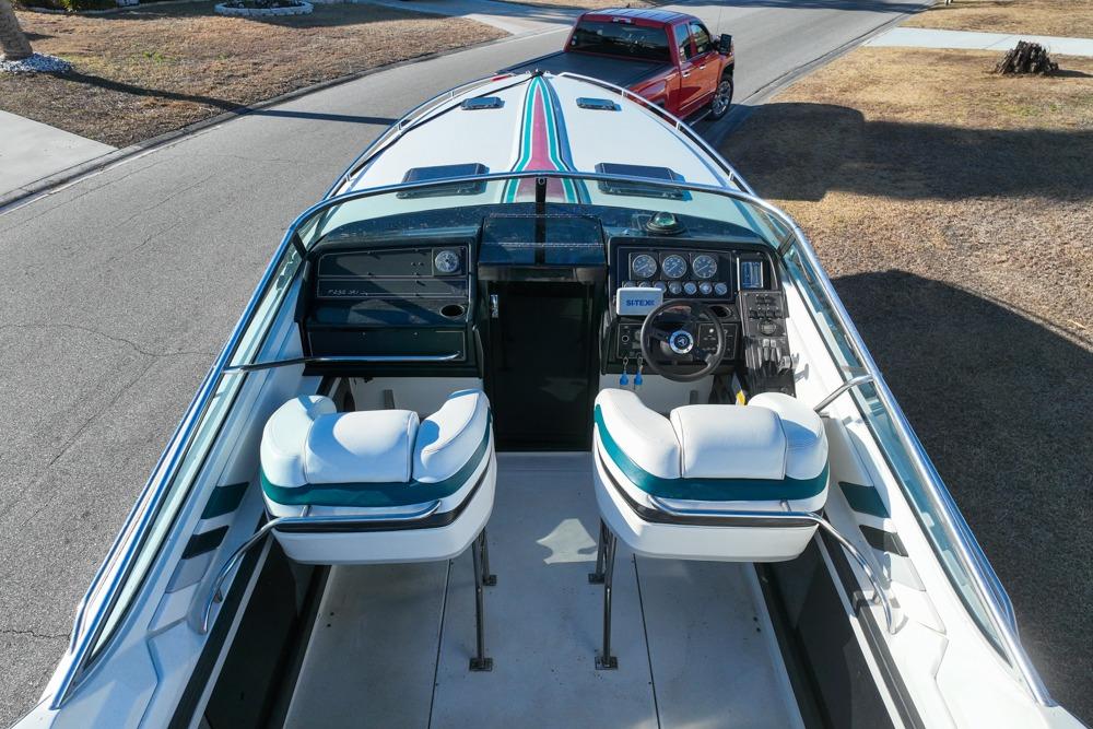 1989 Formula 292 SR-1 boat interior with dual seats and dashboard, parked on a street.