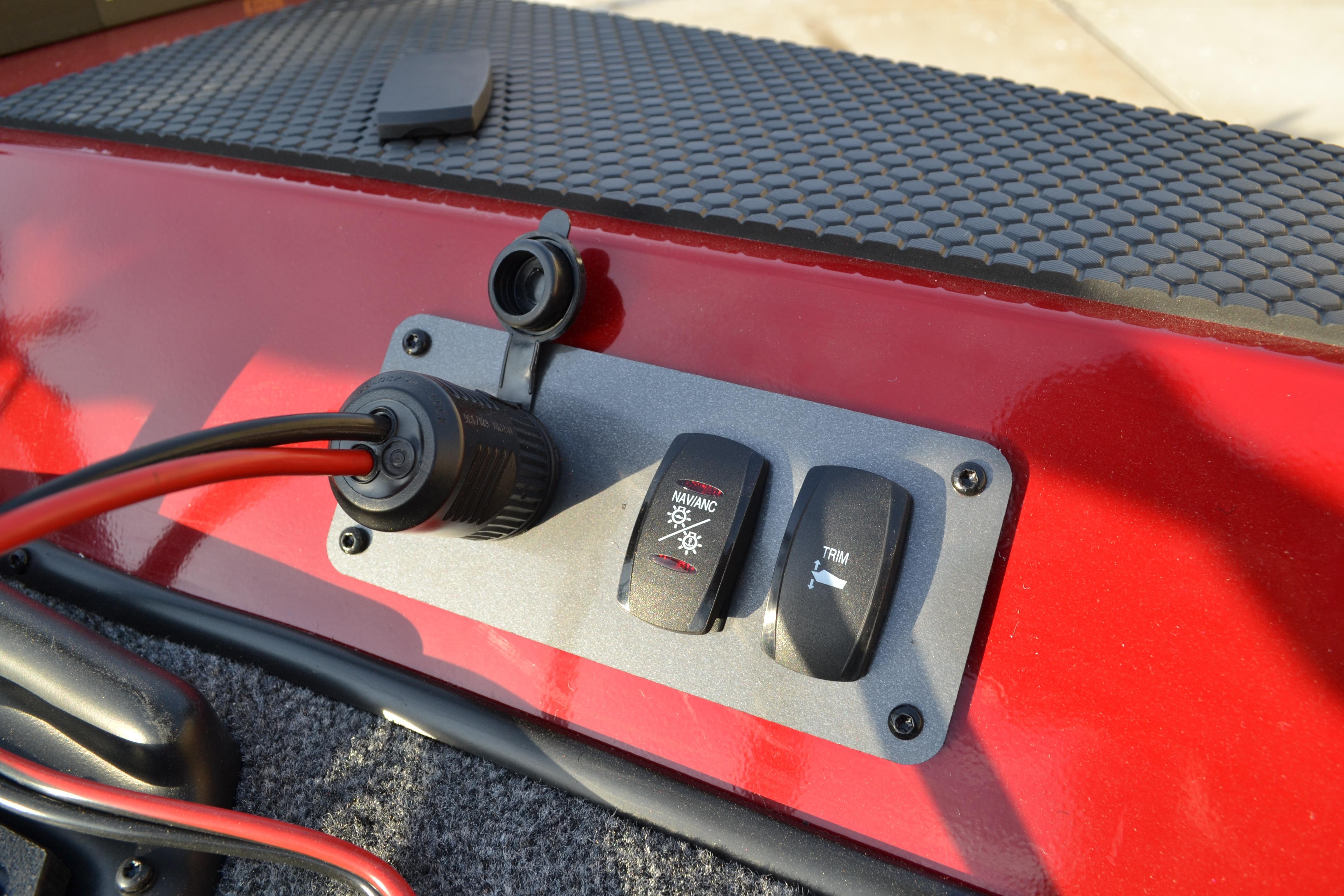 Control panel on 2026 Ranger RT188 boat with switches and power outlet.