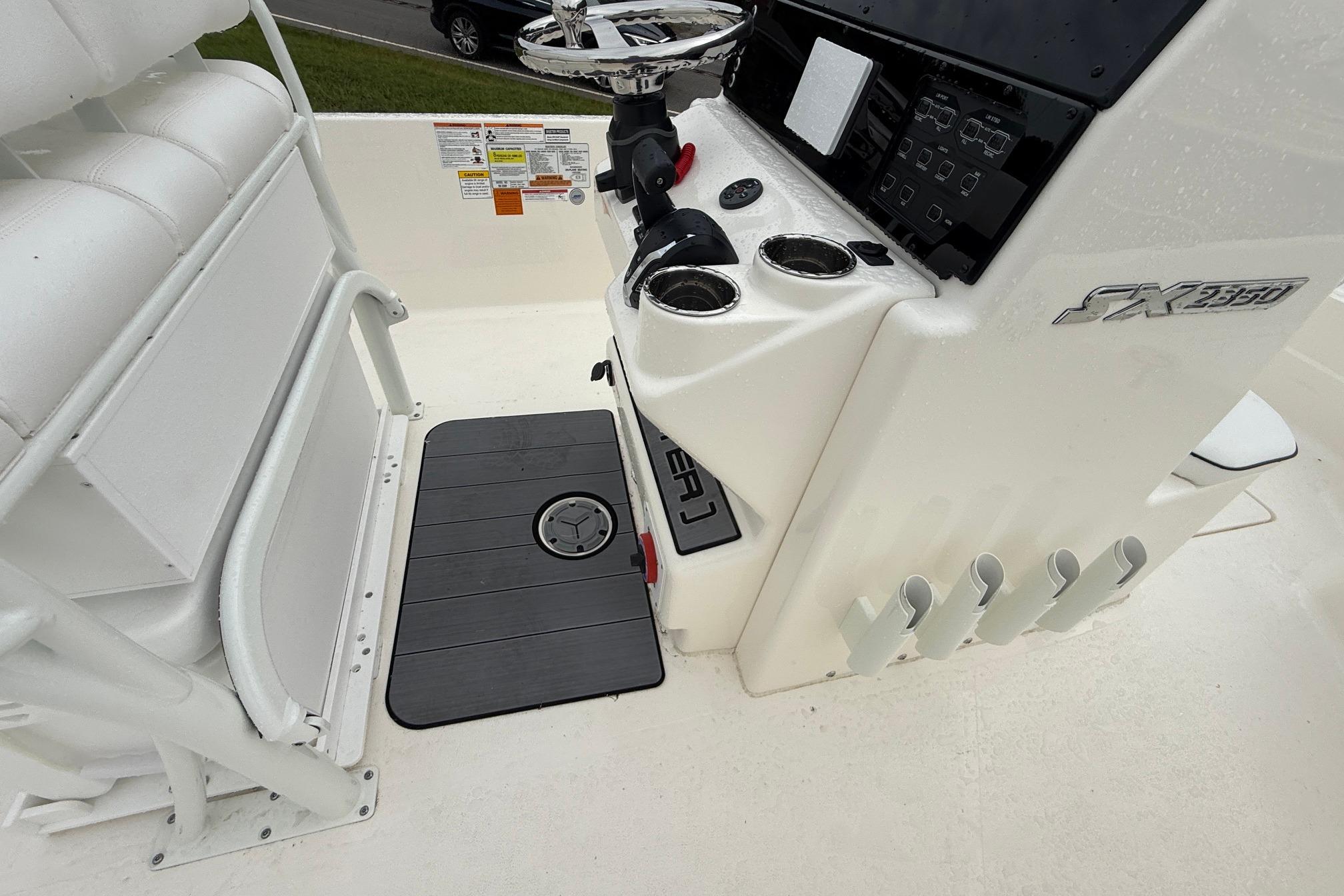2026 Skeeter SX2350 boat console with steering wheel and cup holders.