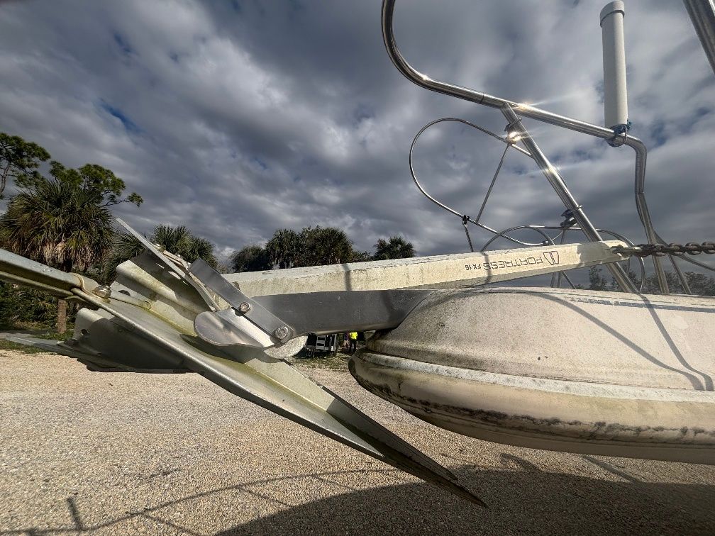 Close-up of a 1997 Donzi 275LXC boat anchor under cloudy sky.