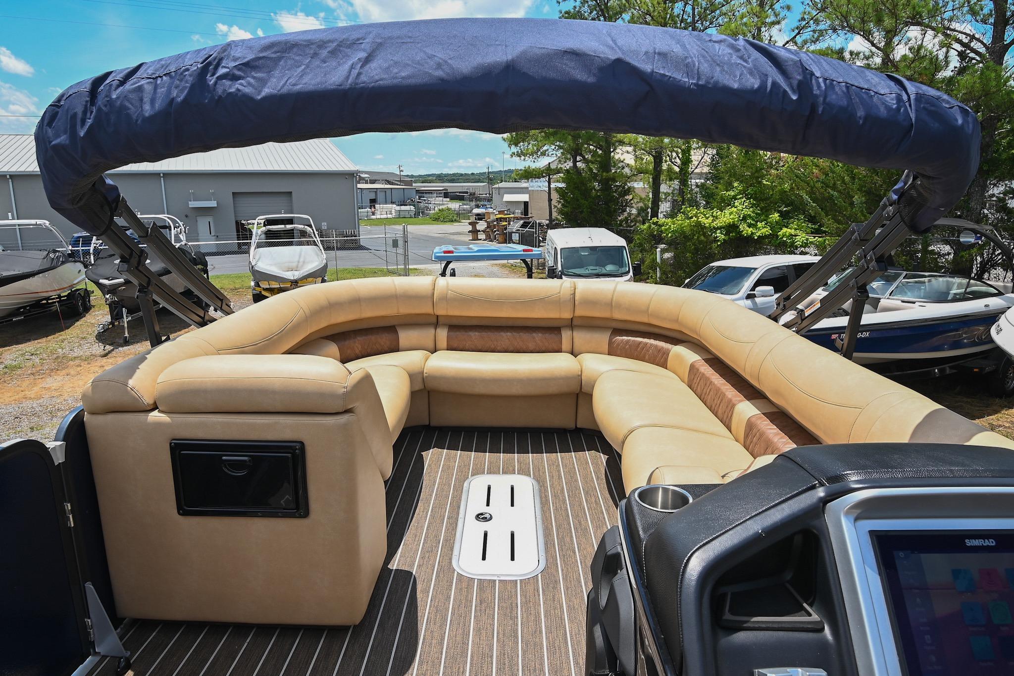 2023 Premier 270 Intrigue RF pontoon boat with luxurious seating and canopy.
