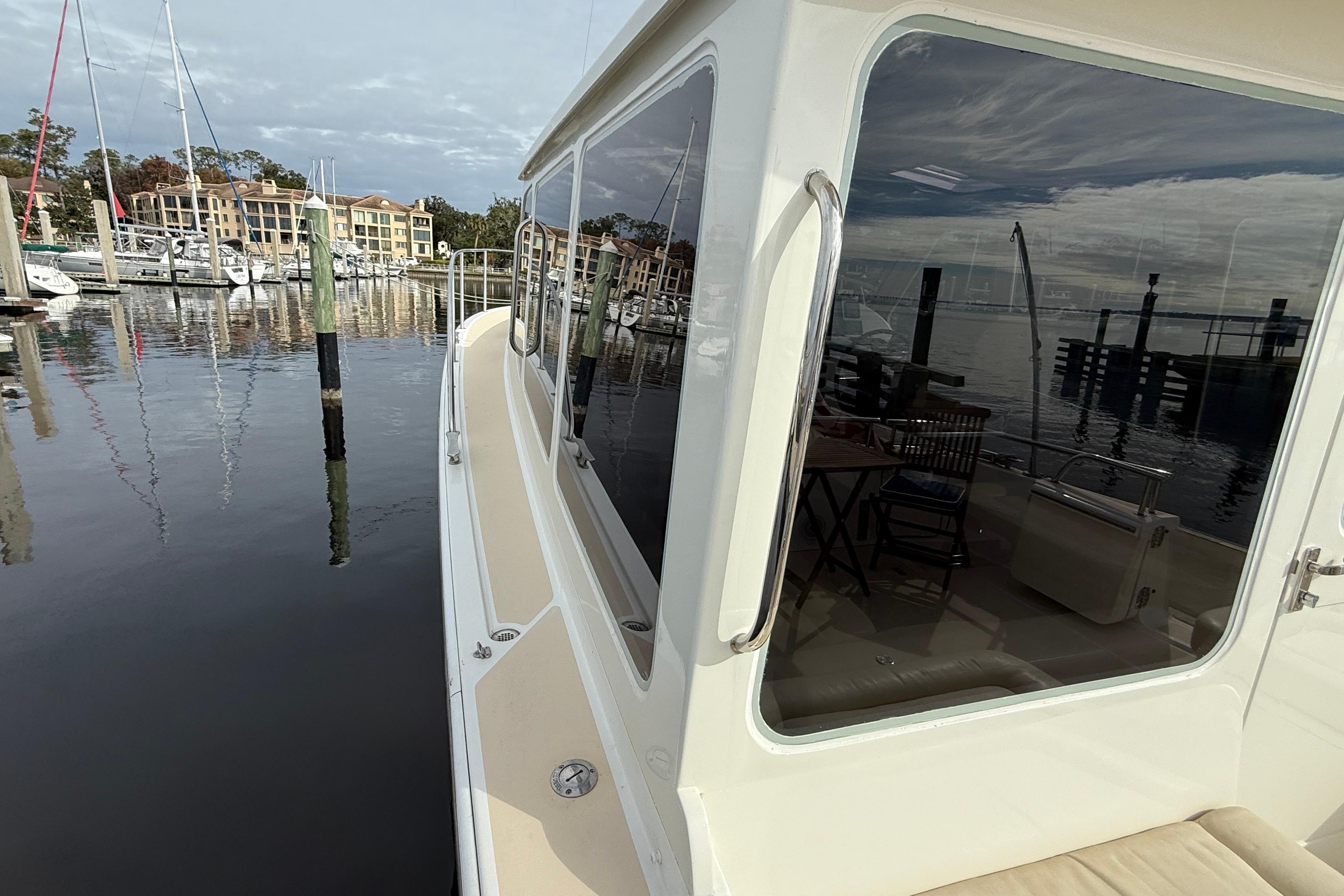2012 MJM 40z yacht docked at marina with waterfront view.