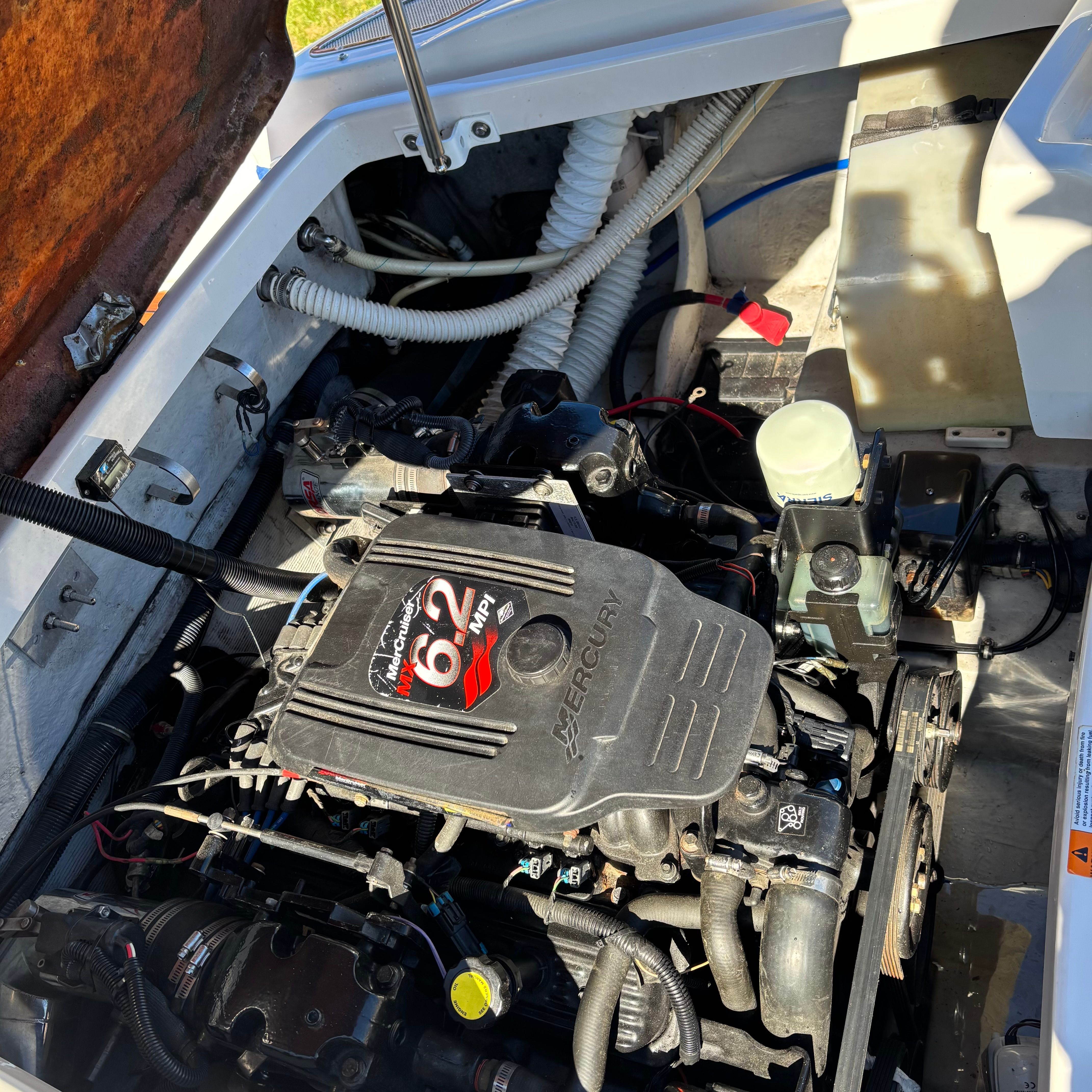Engine compartment of a Chris-Craft Launch 22 boat with a 6.2-liter Mercury engine.