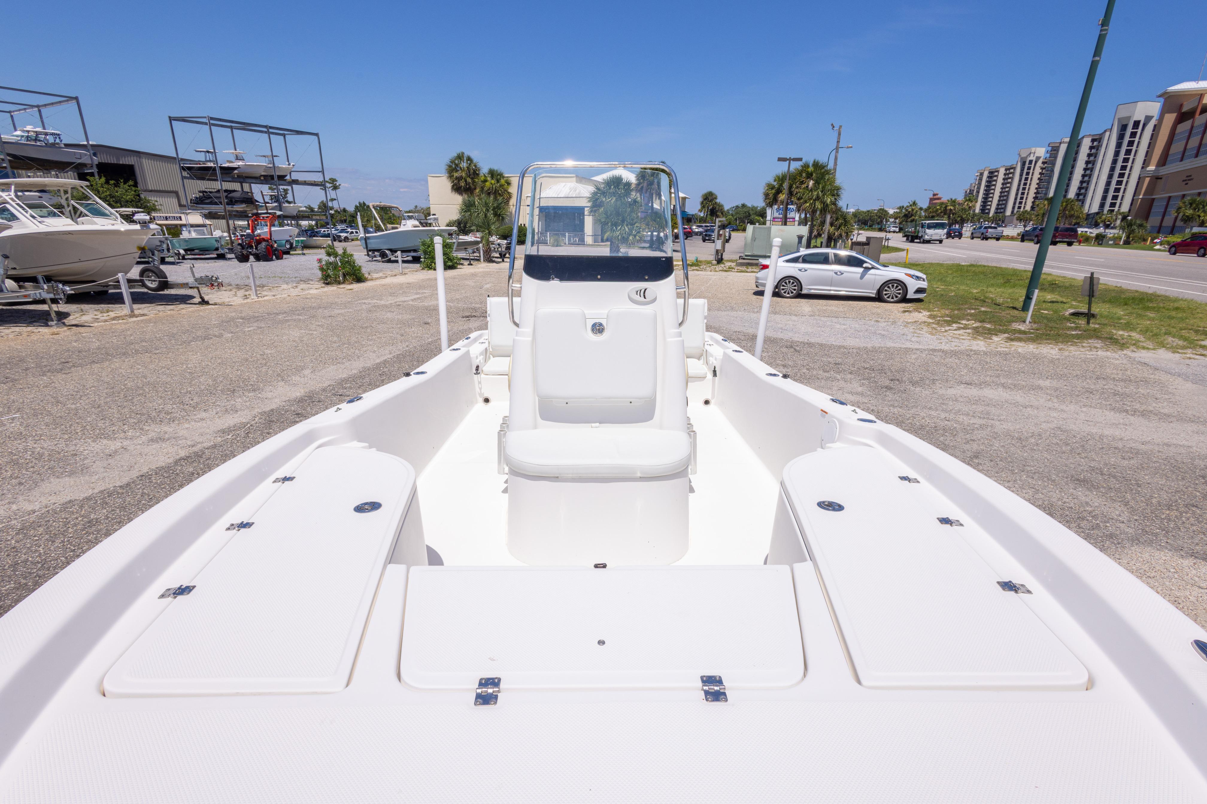 2011 Sea Fox 200XT boat on display in a marina parking lot.