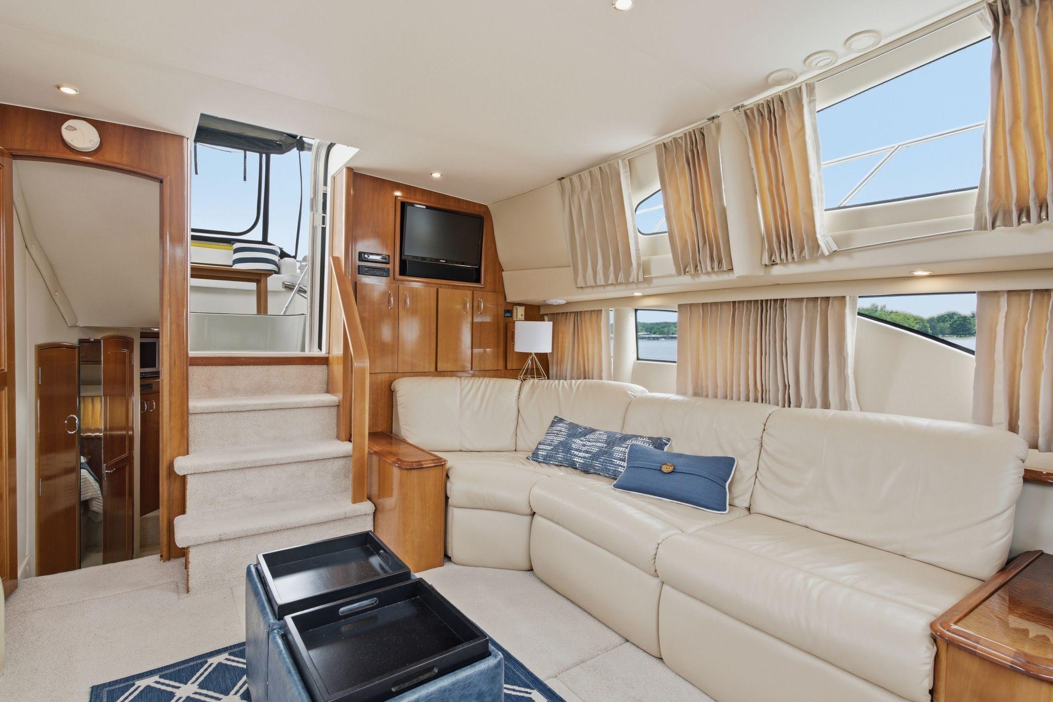 Luxurious interior of 2005 Carver 39 Motor Yacht with plush seating and elegant decor.