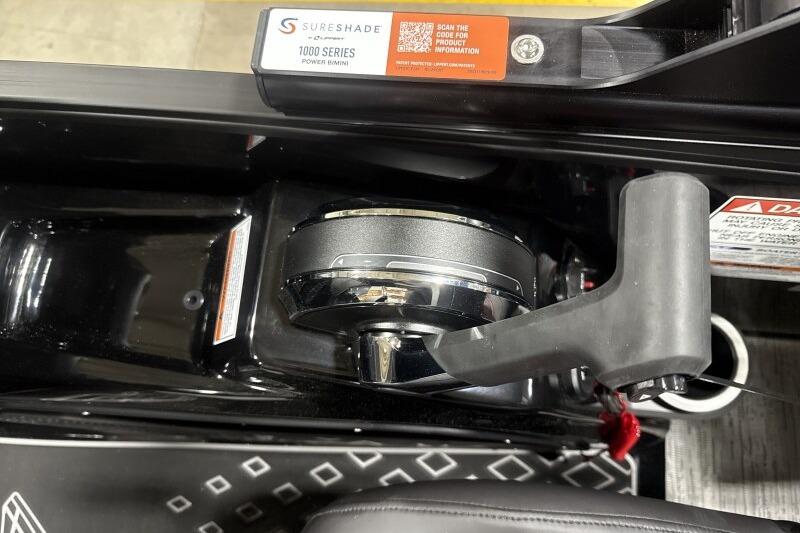 Close-up of 2026 Bennington 24 MFBSF boat control panel with SureShade 1000 Series power bimini.