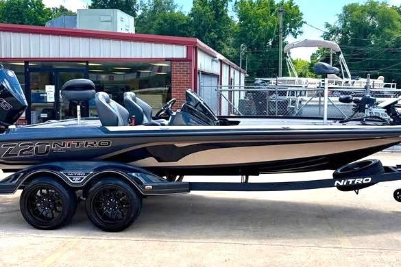 2026 Nitro Z20 XL Pro boat displayed outdoors, featuring sleek design and dual-axle trailer.