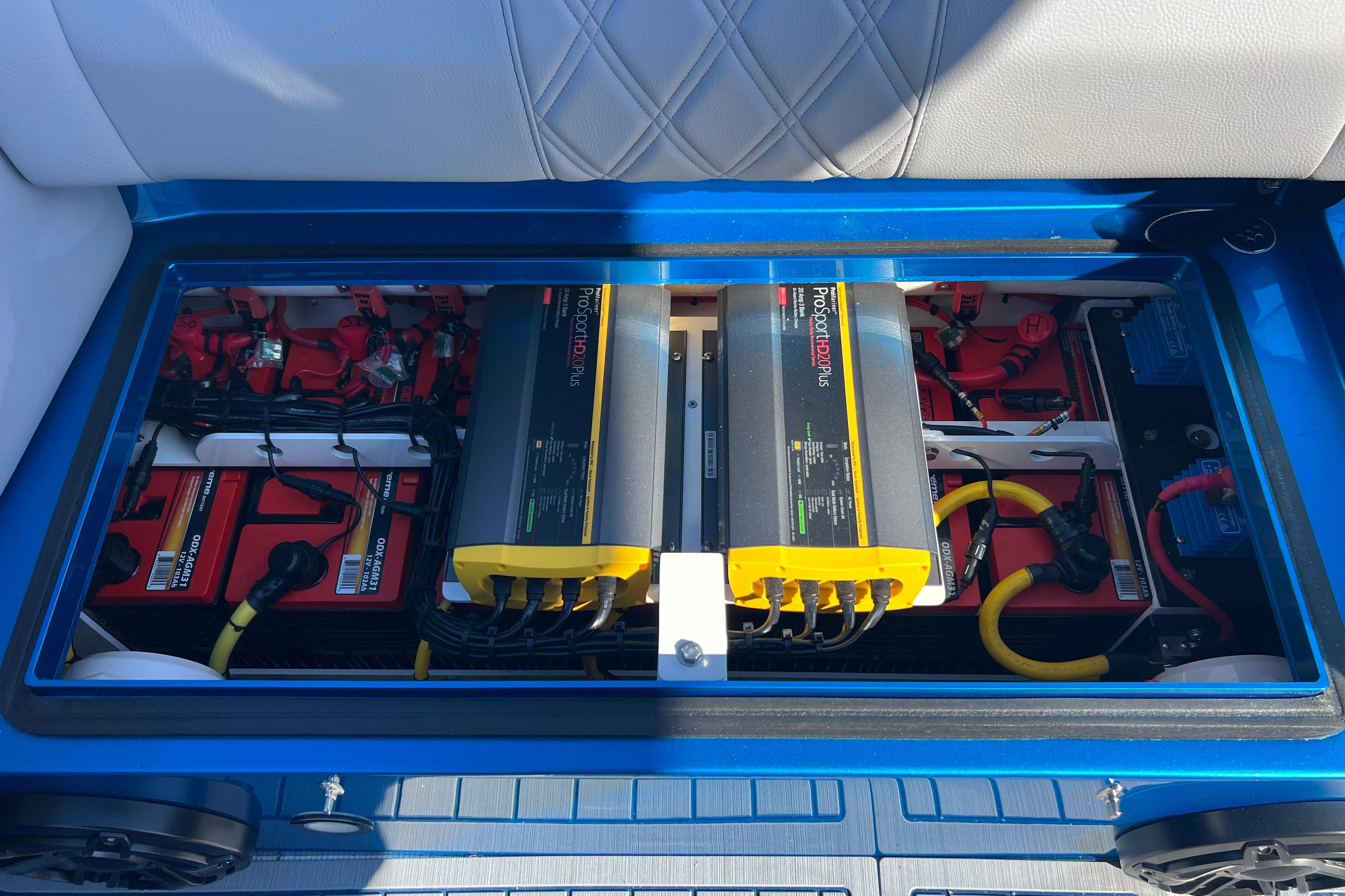 Battery compartment of 2026 Nor-Tech 450 Sport boat, featuring ProSportHD Plus chargers.