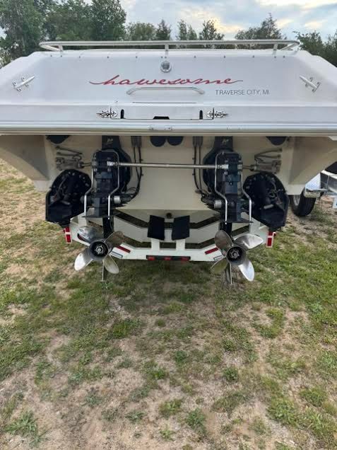 Rear view of a 2001 Fountain Lightning boat on grass.