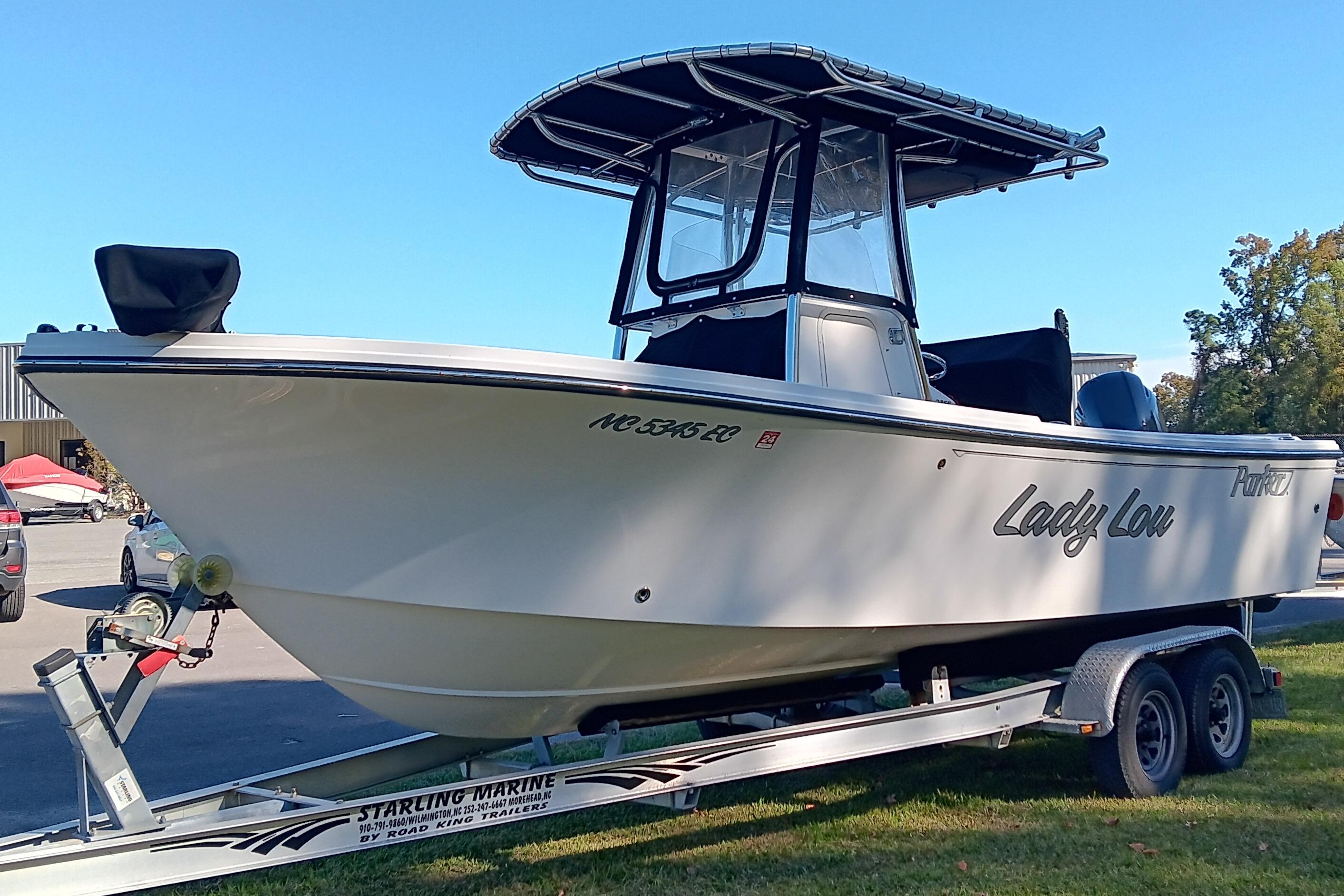2016 Parker 2300 Special Edition boat on trailer, named "Lady Lou," in outdoor setting.