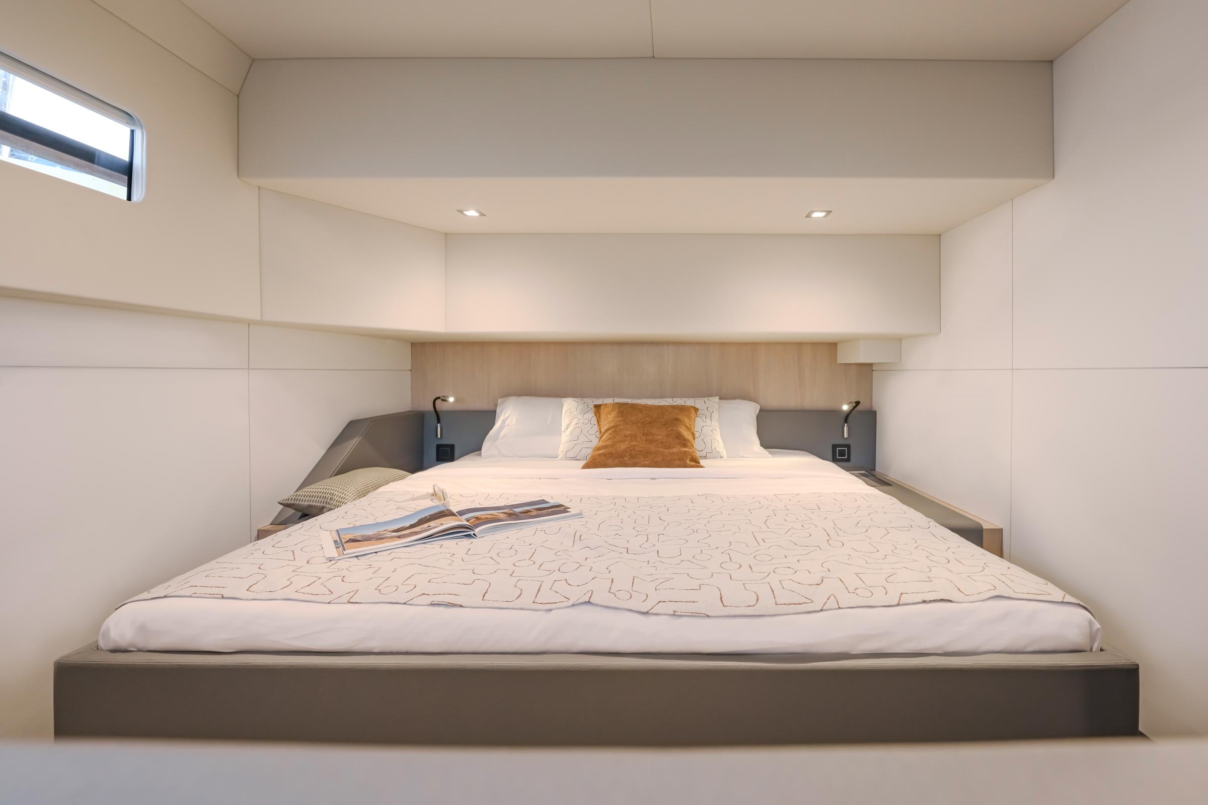 Luxurious bedroom interior of 2025 Privilege Signature 650 yacht with modern design.