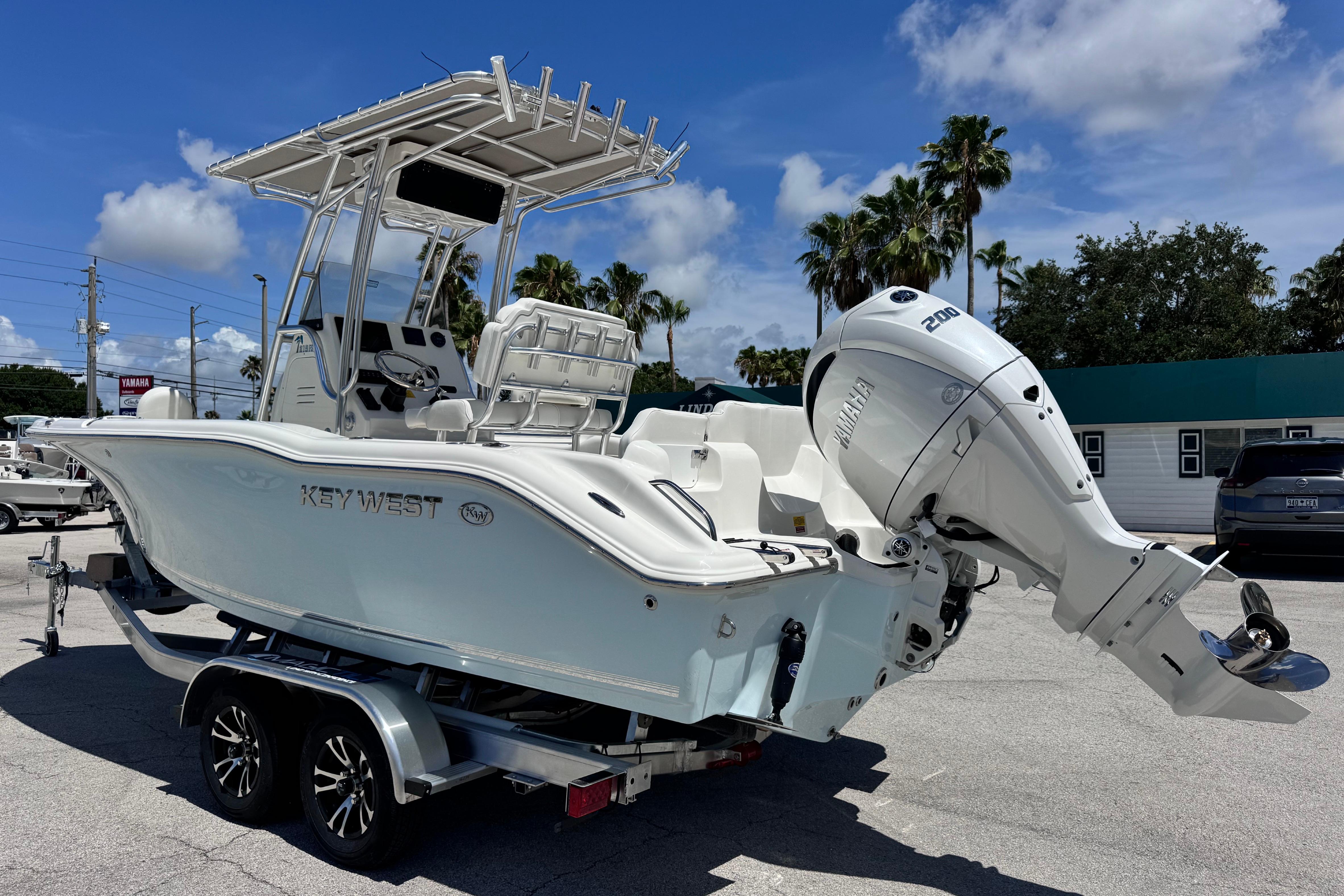 2026 Key West 219 FS boat with Yamaha engine on trailer, parked outdoors.