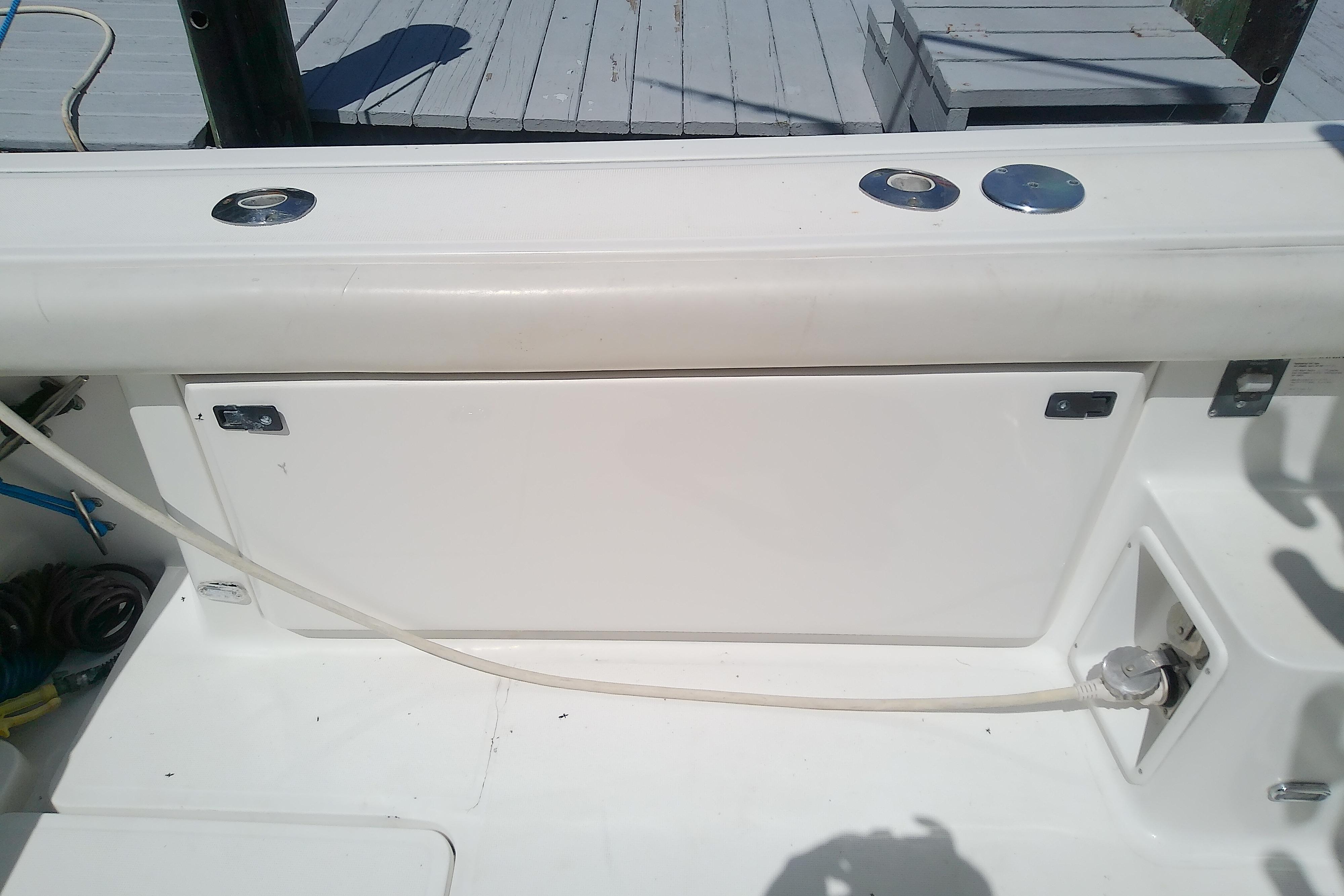 2000 Tiara Yachts 4100 Open deck detail with storage compartment and utility connections.