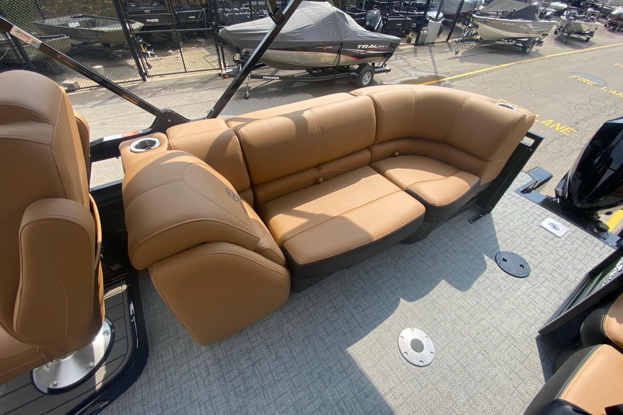 Luxurious tan seating on 2026 Regency 230 DL boat, showcasing comfort and style.