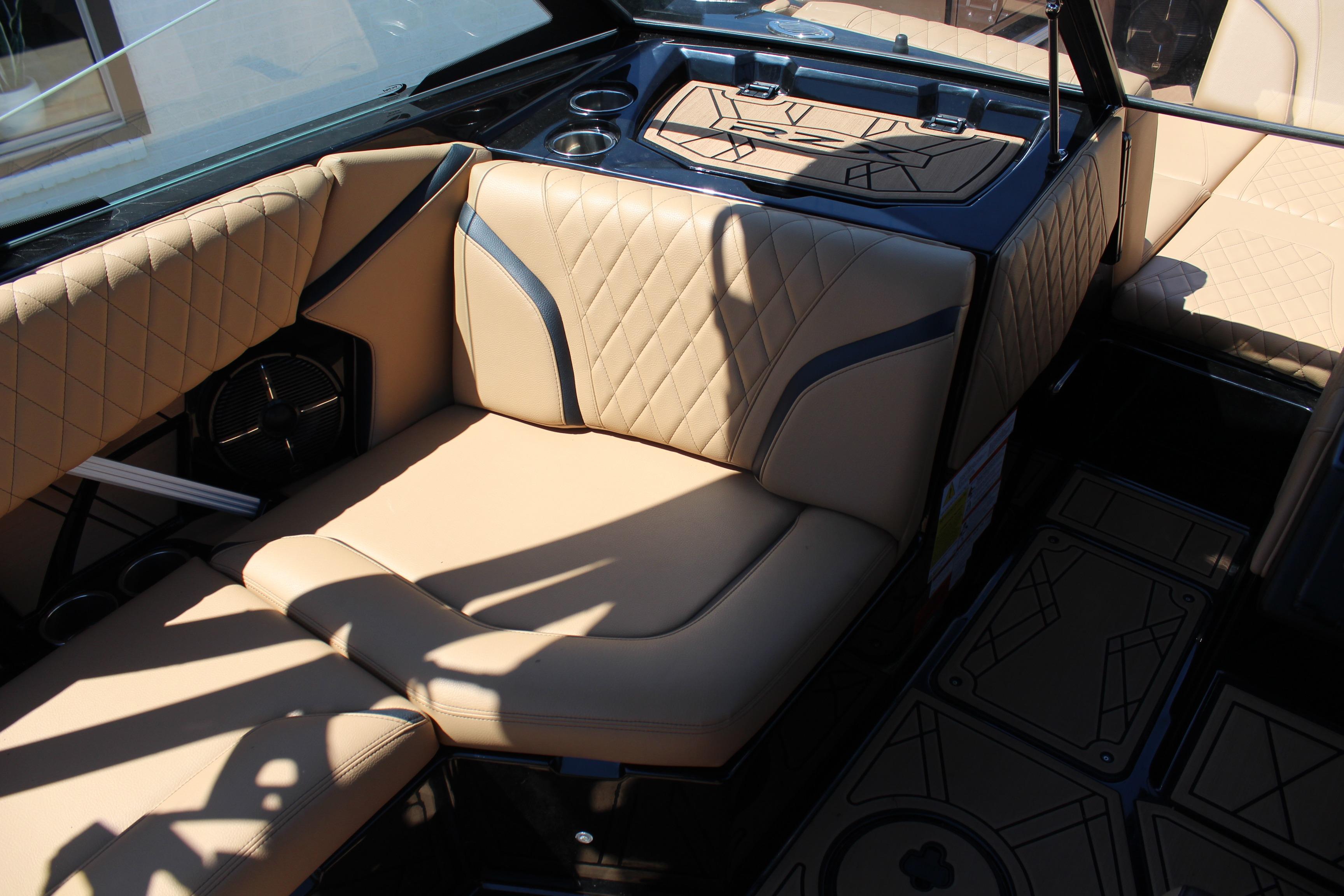 2022 Tigé 22RZX boat interior with beige diamond-stitched seating and modern design.