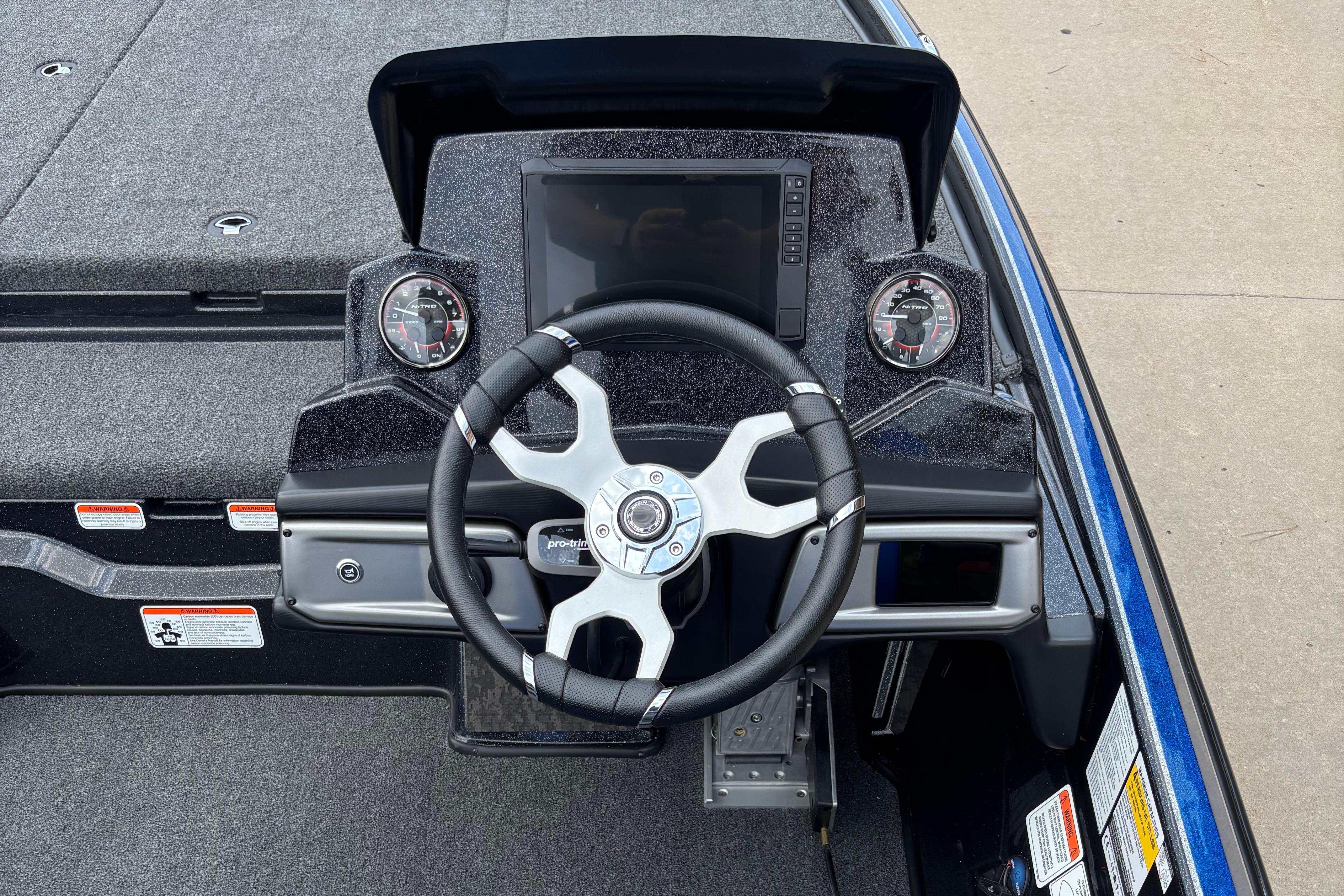 2026 Nitro Z20 XL Pro boat dashboard with steering wheel and gauges.
