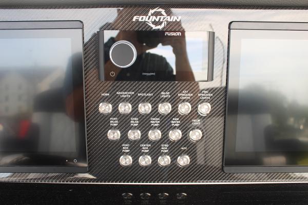 2024 Fountain 34 SC dashboard with dual screens and control panel.