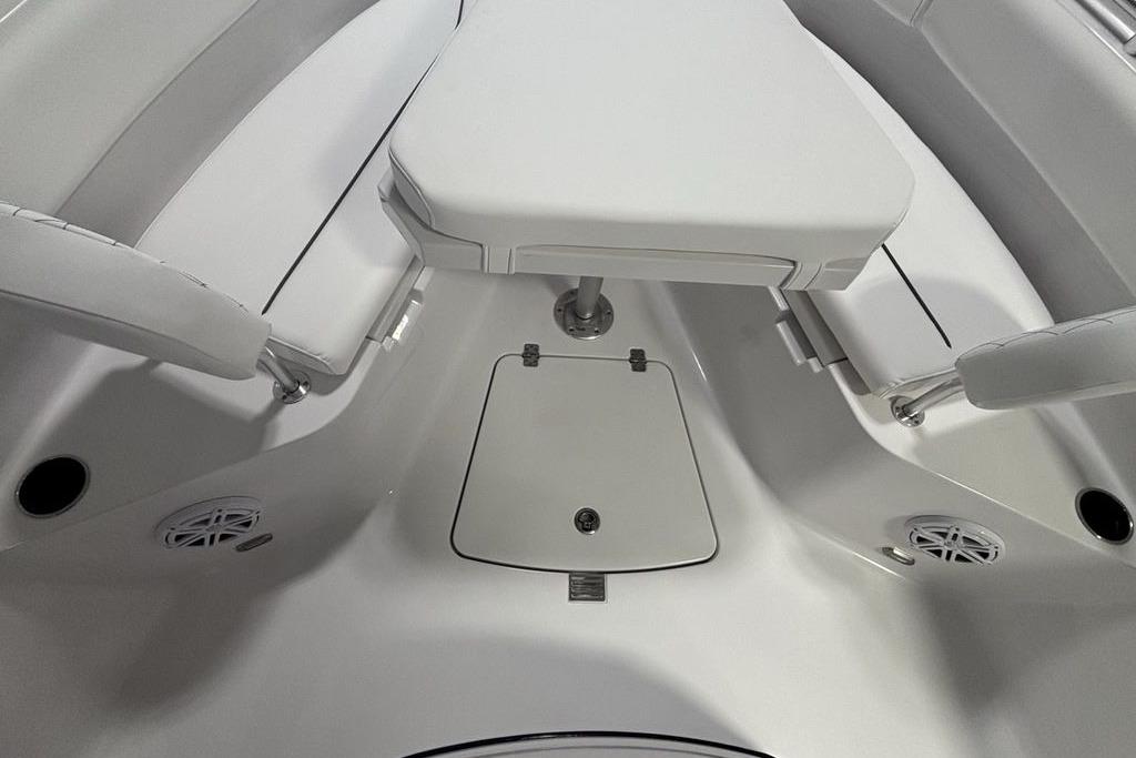 2026 Sportsman Open 252 Center Console boat interior with seating and storage.