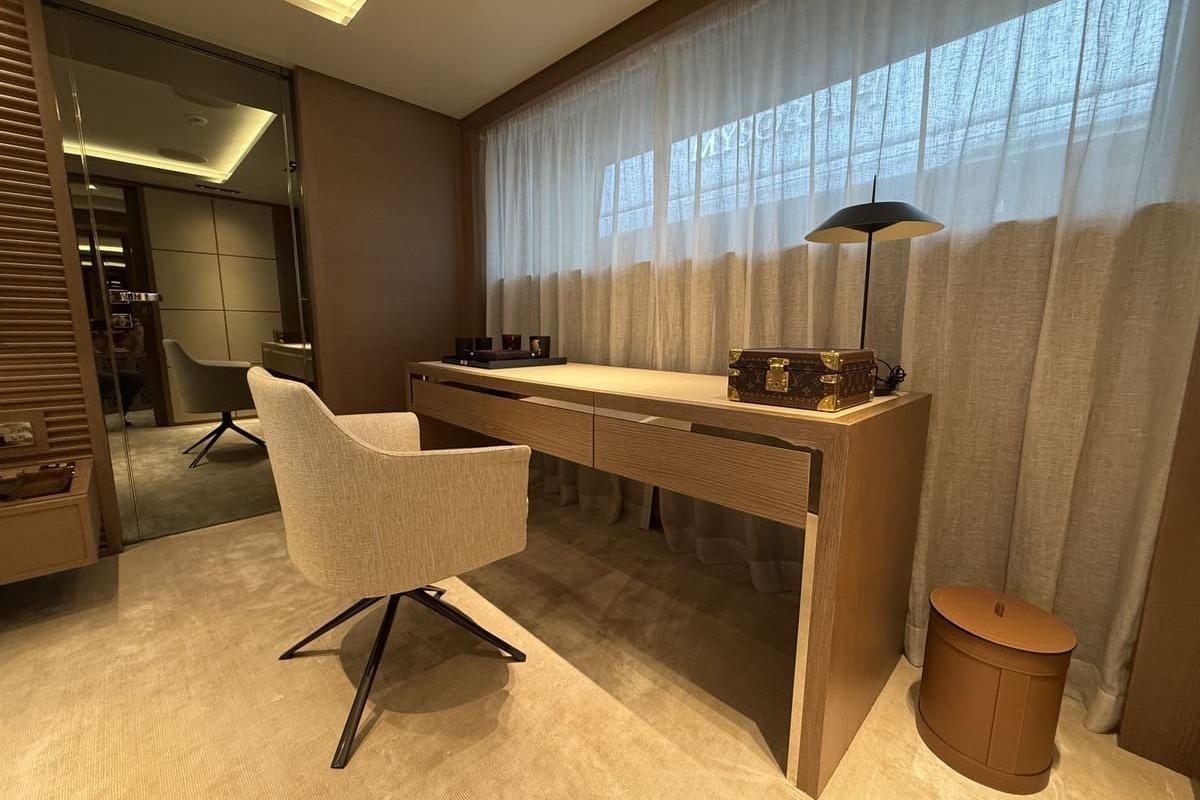 Luxurious interior of 2023 Sanlorenzo 44Alloy yacht with elegant desk and chair setup.