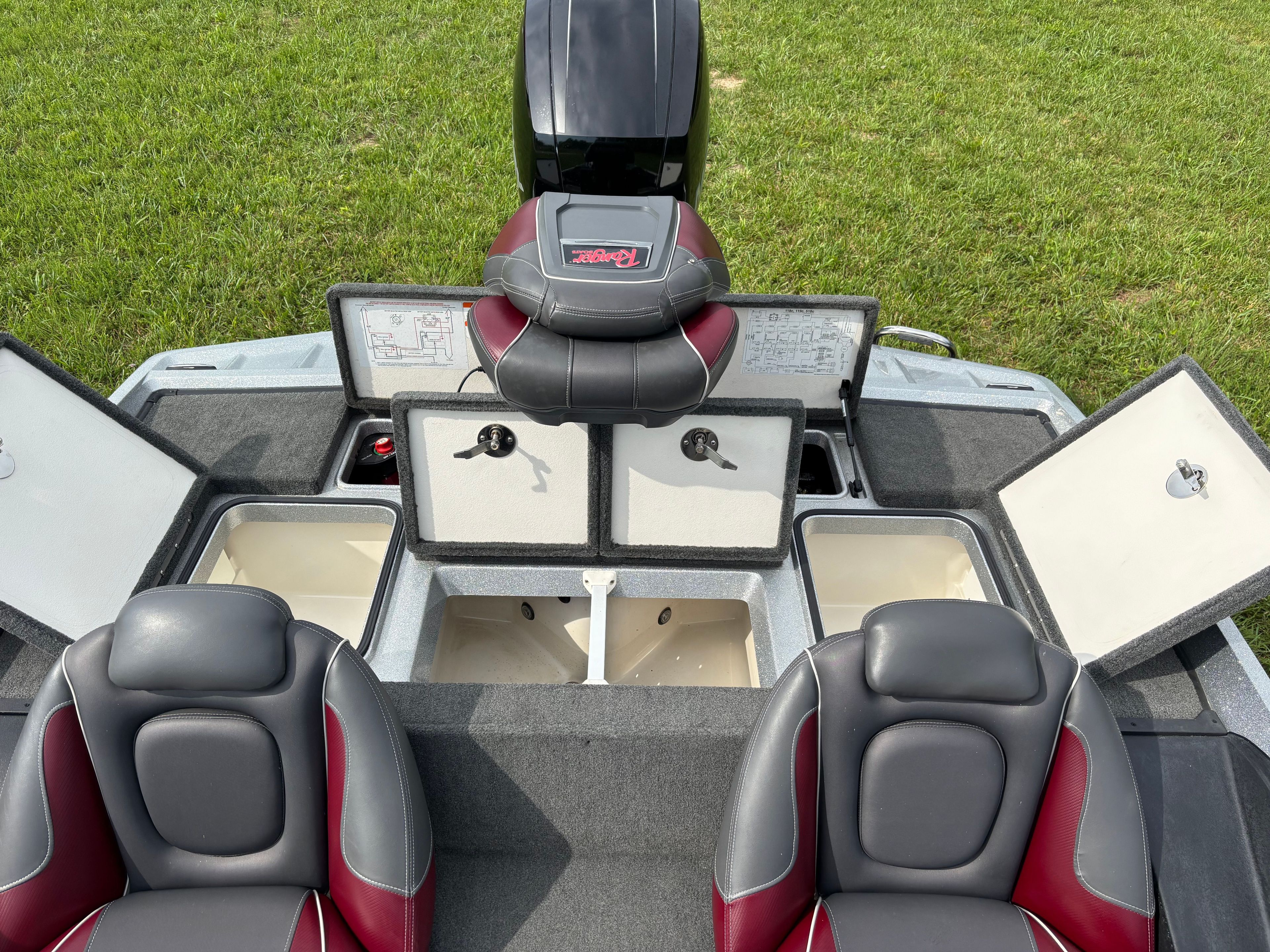 The image shows the interior of a Ranger Z 185 boat with seats and storage compartments.