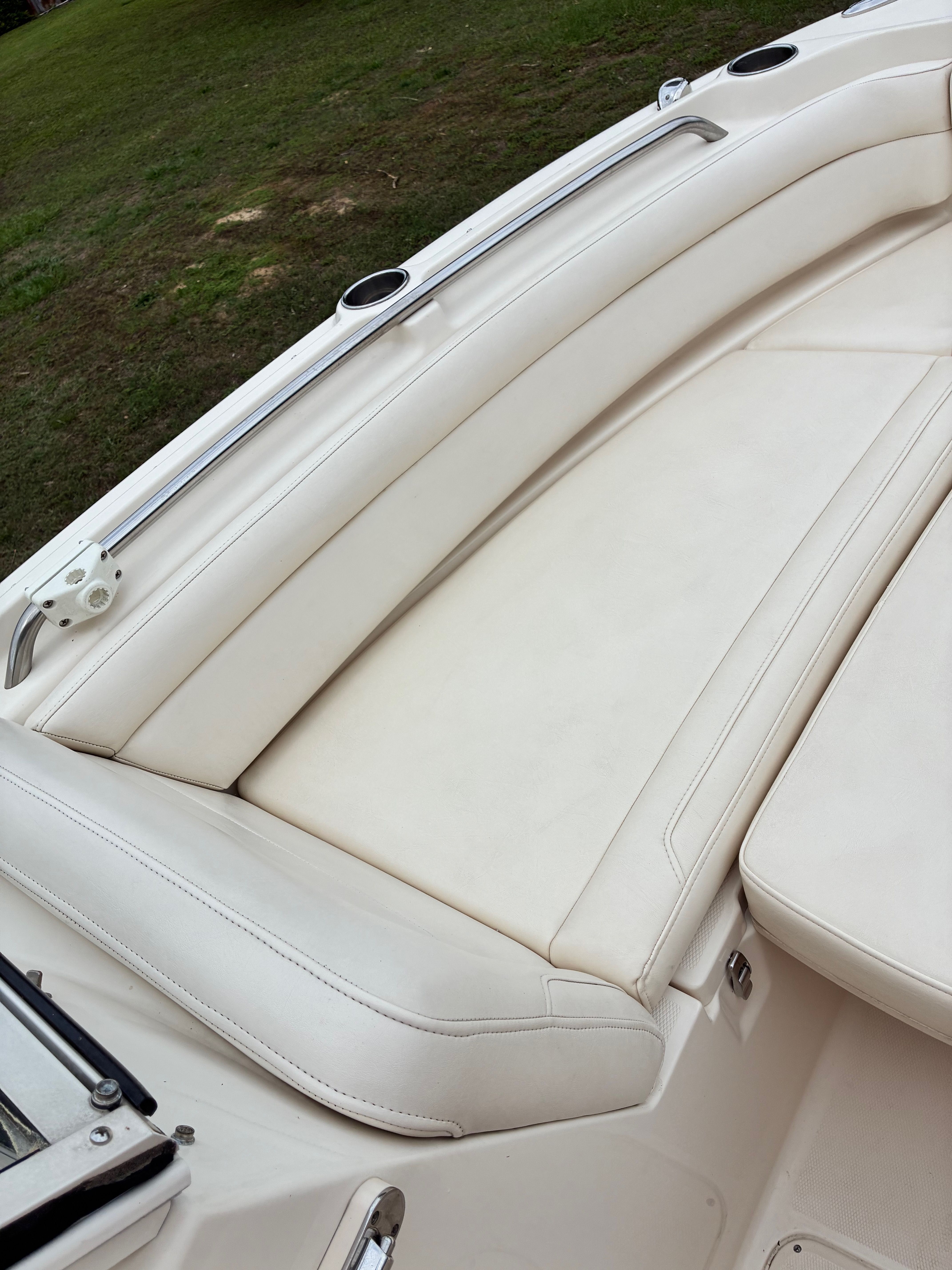 Interior view of a 2018 Grady-White Freedom235 boat with white seating.