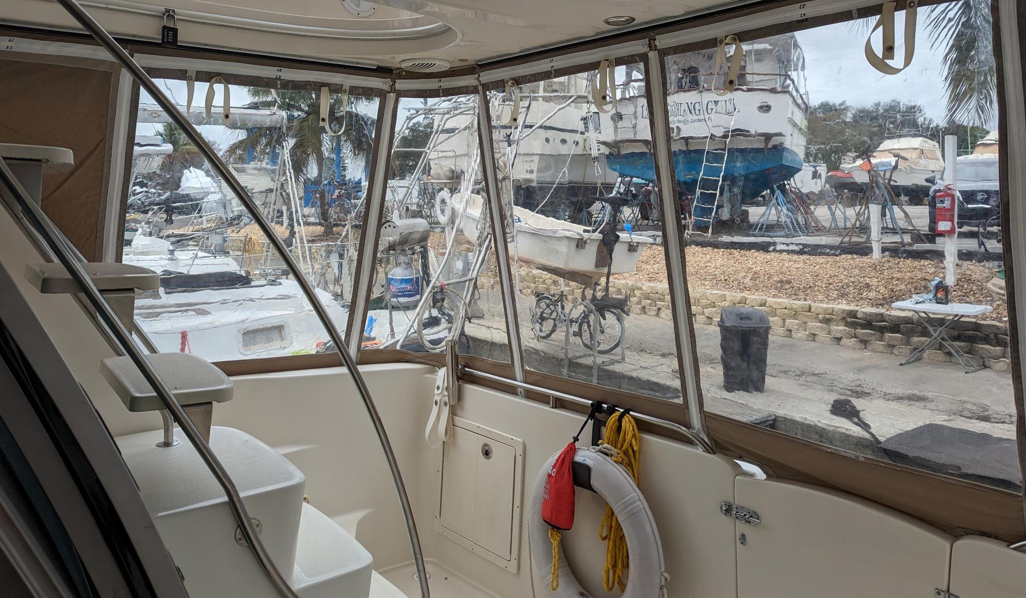 Interior view of 1999 Maxum 4100 SCB yacht with marina background.