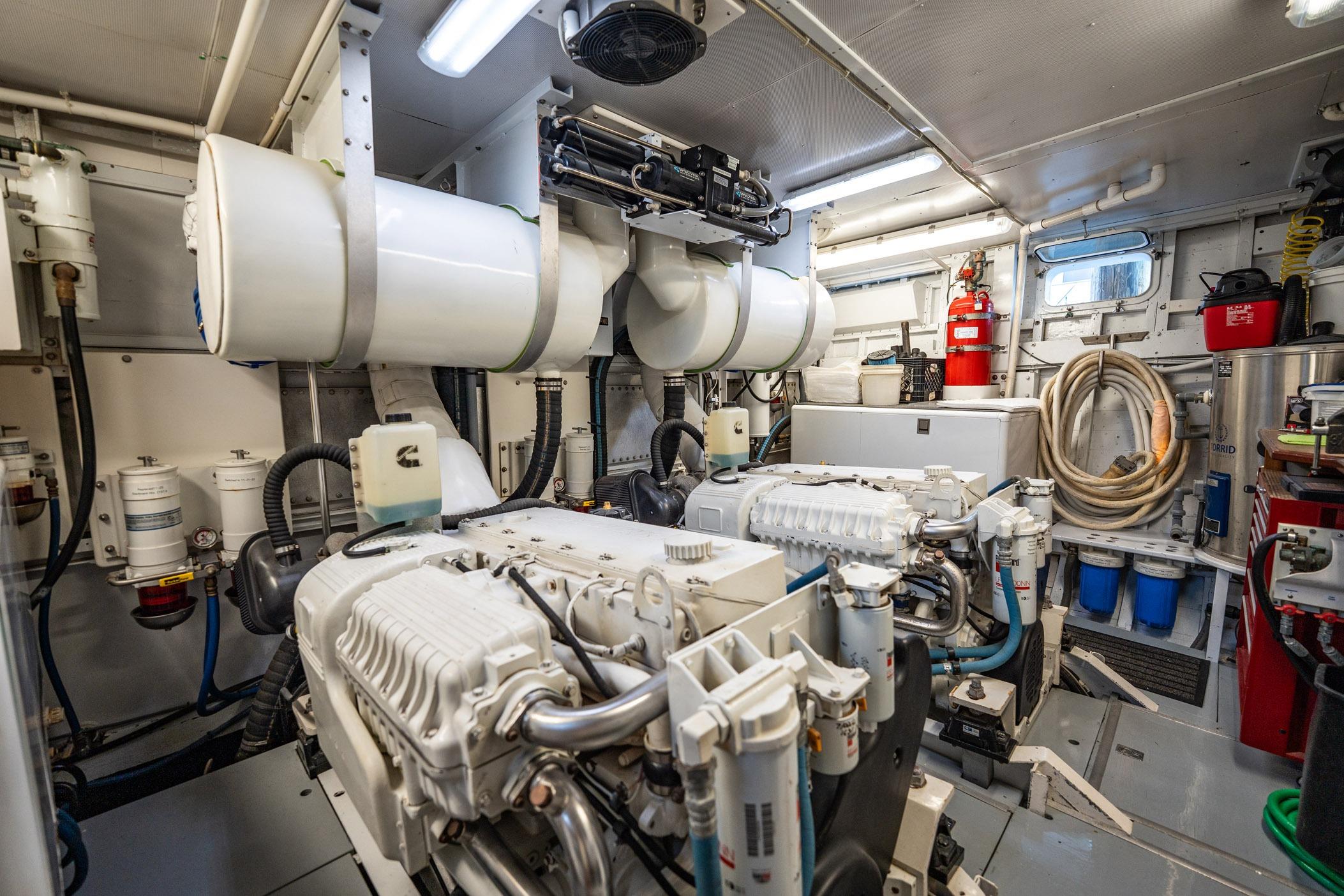 Engine room of a 1972 Trumpy 72 Motor Yacht, featuring machinery and equipment.