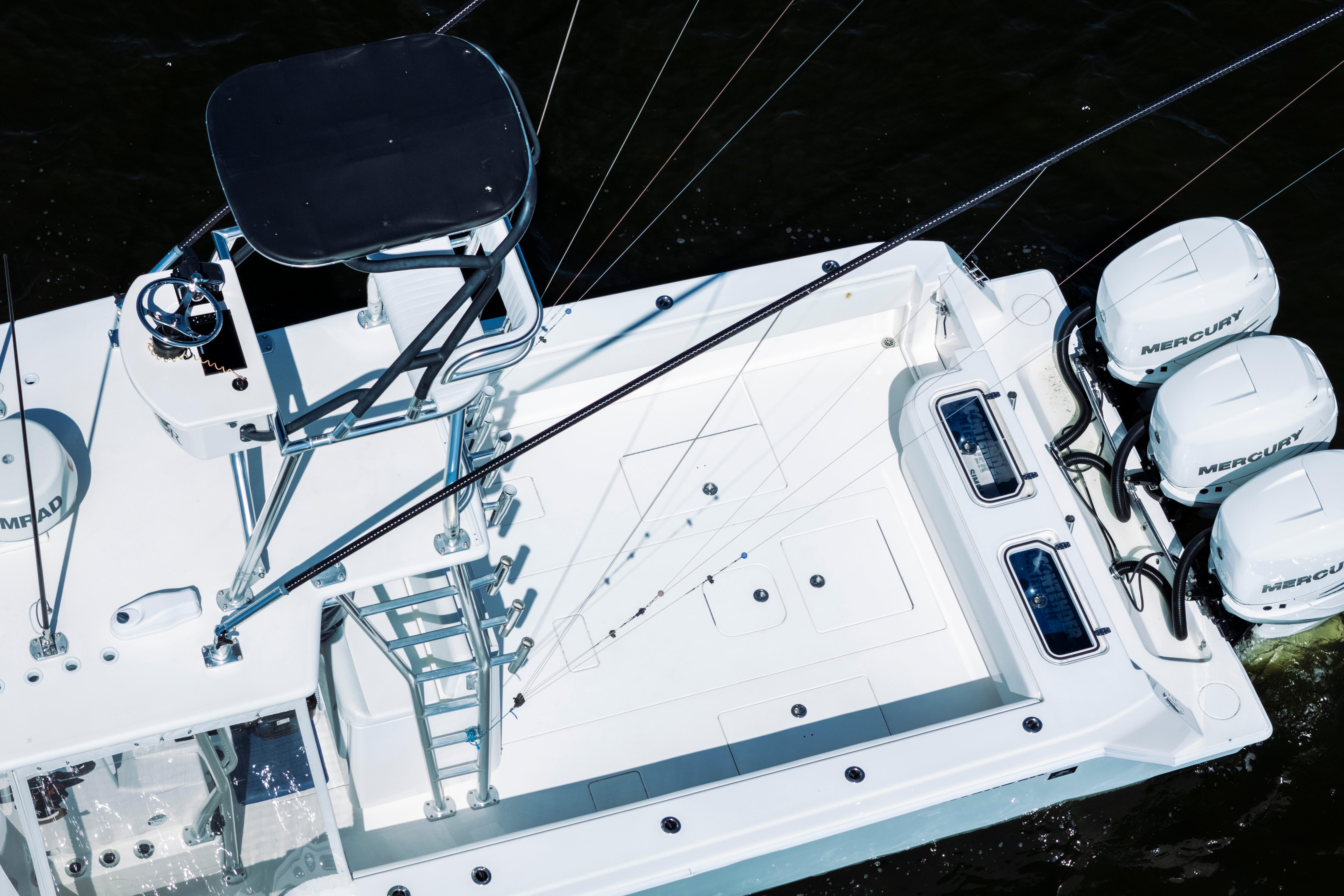 2015 Contender 39 ST boat with triple Mercury engines, aerial view.