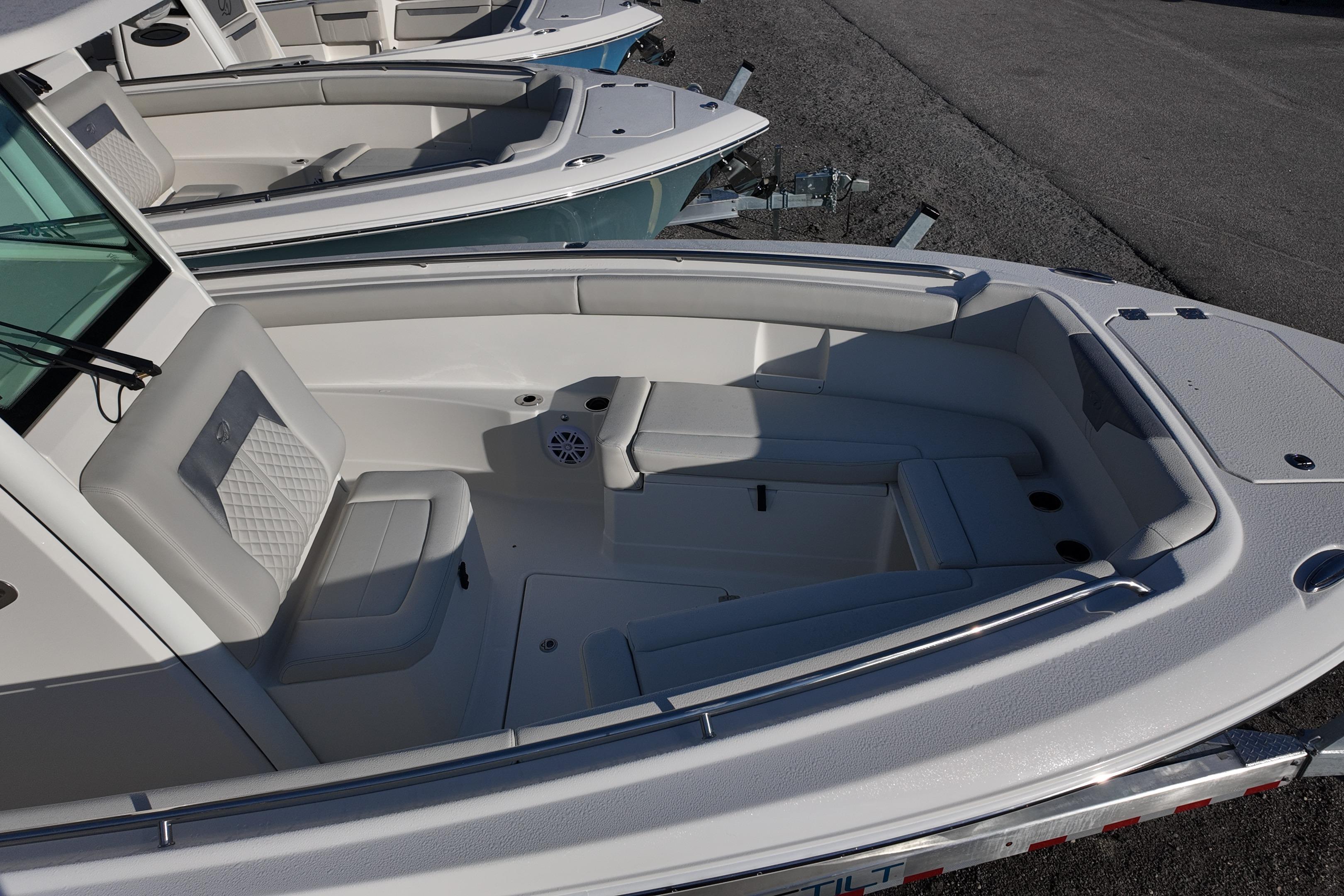 2026 Sailfish 272 CC boat interior with cushioned seating and speaker system.