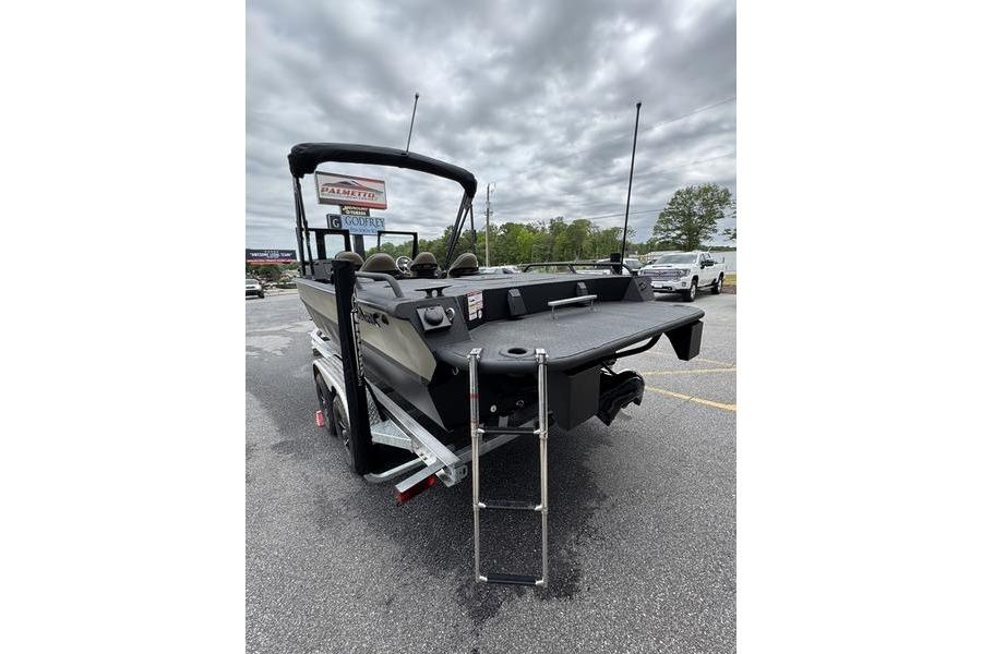 2026 SeaArk Predator 300 AK boat with ladder, parked outdoors under cloudy skies.