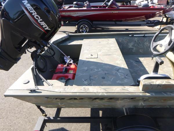 2024 Tracker Grizzly 1648 SC boat with Mercury engine, parked on a trailer.