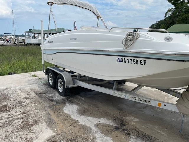 A 2018 Hurricane SS188 boat on a trailer on land.