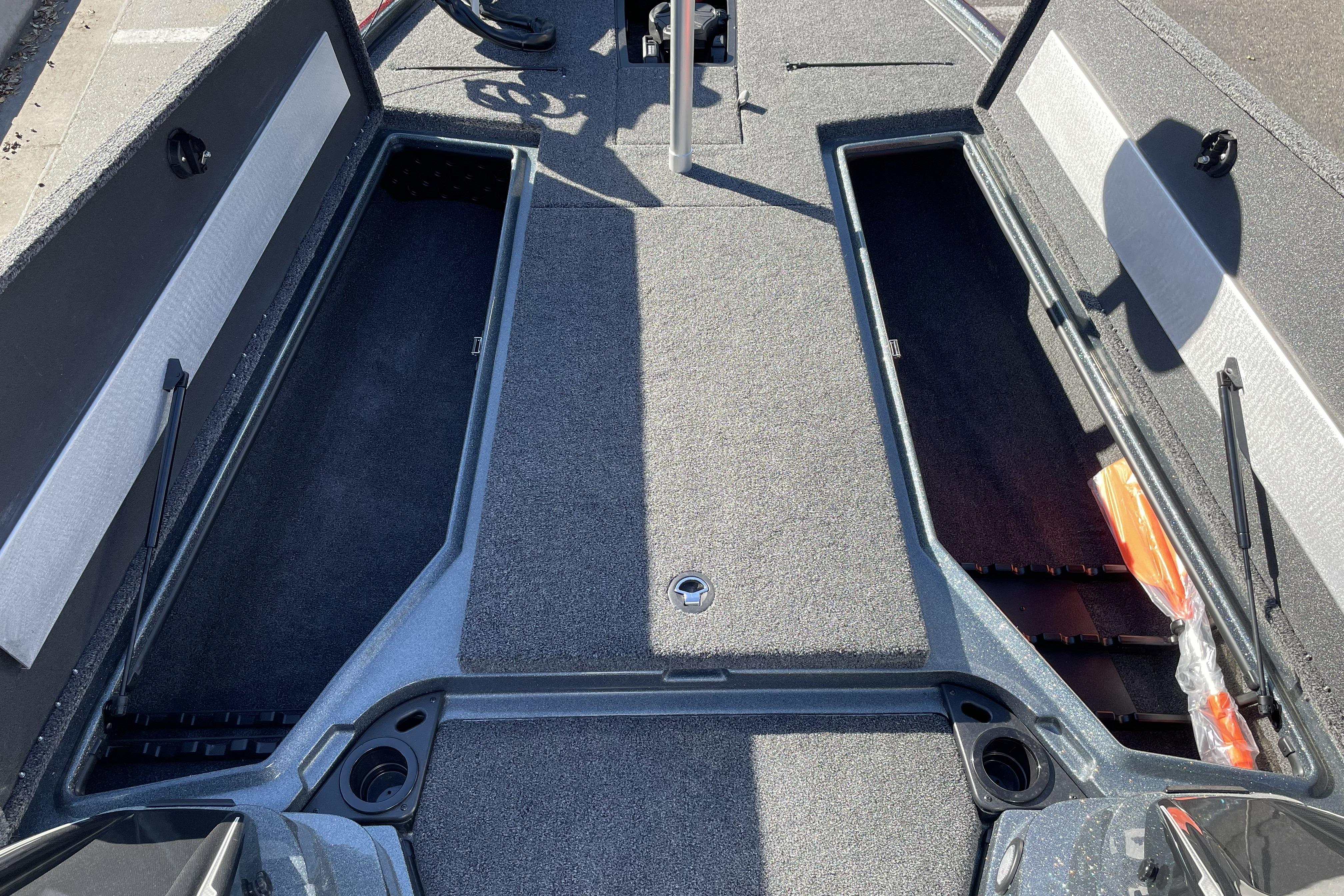 2026 Nitro Z20 XL boat interior with open storage compartments and carpeted flooring.