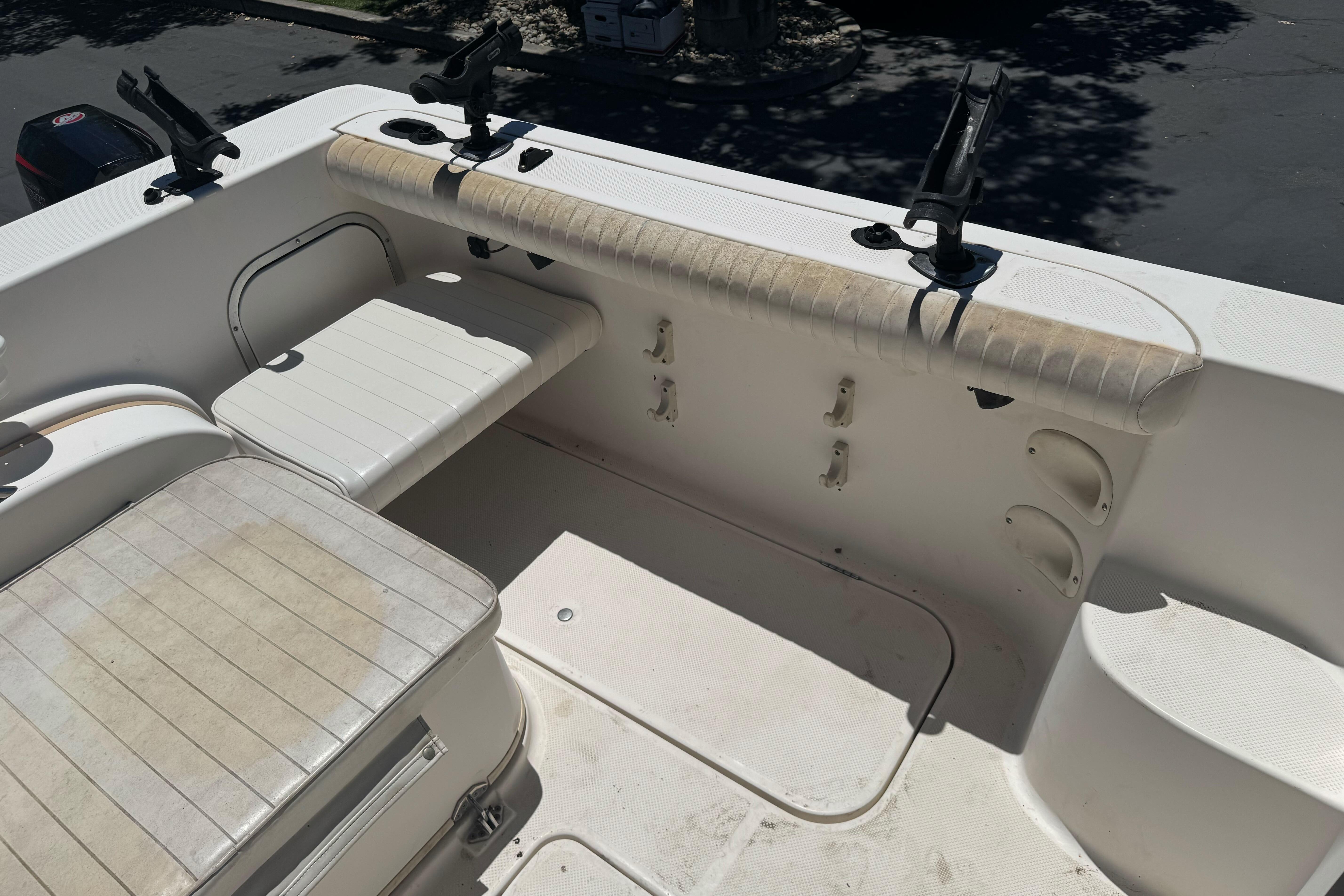 2004 Trophy 2359 WA boat interior with seating and rod holders.